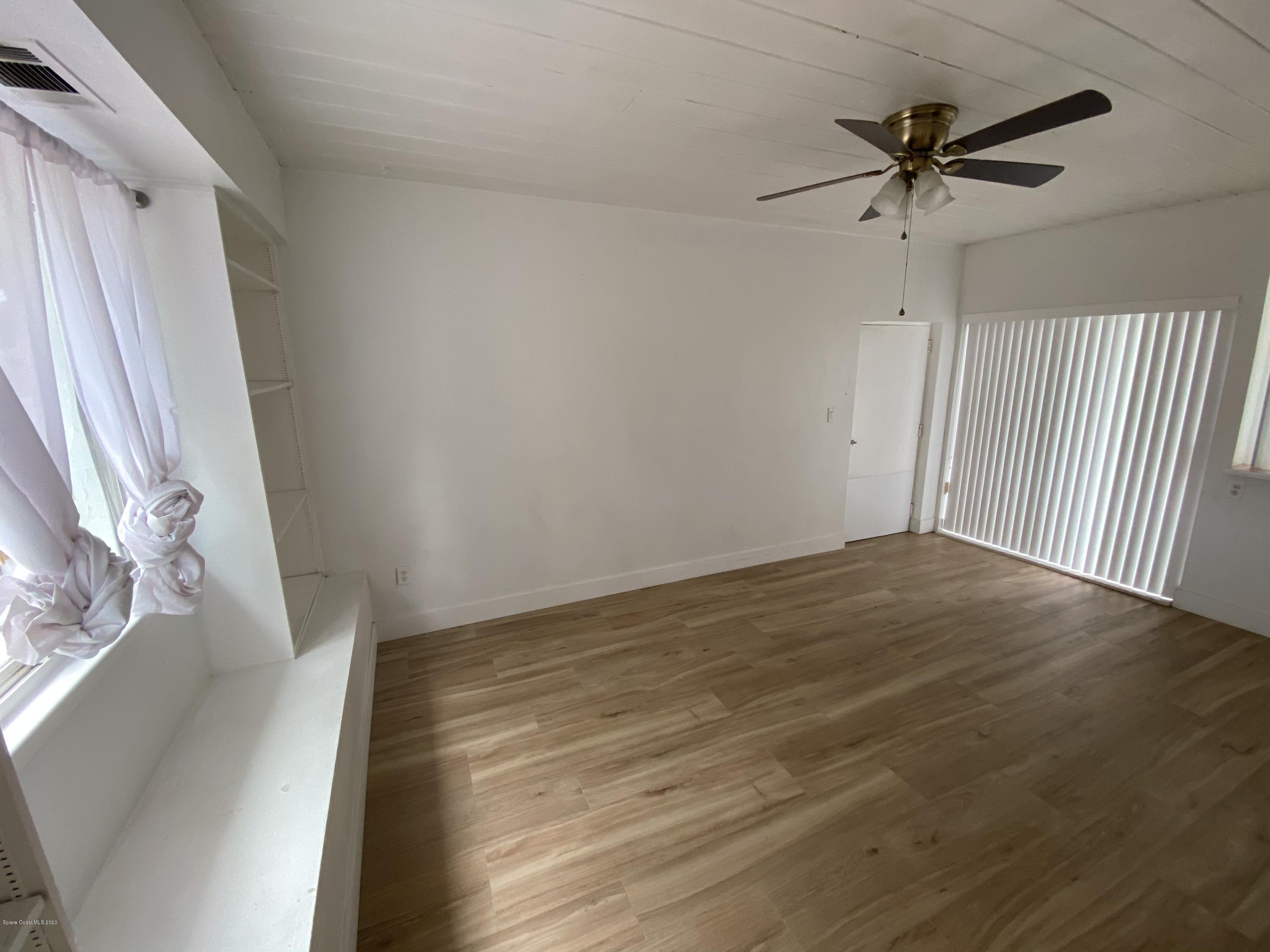 2309 Country Club Road Melbourne, FL 32901 - Photo 9 of 50 a view of an empty room with a window
