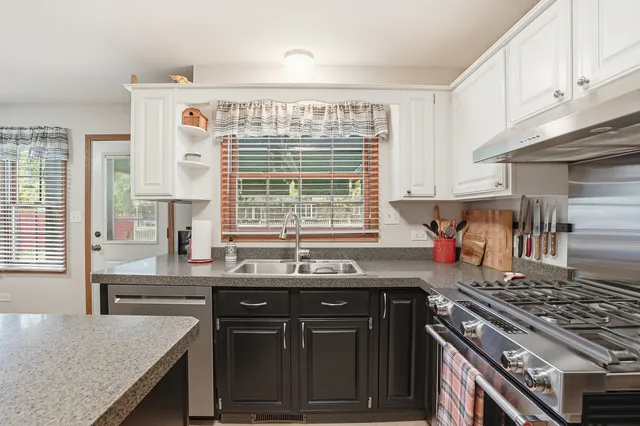 a kitchen with a stove and a sink
