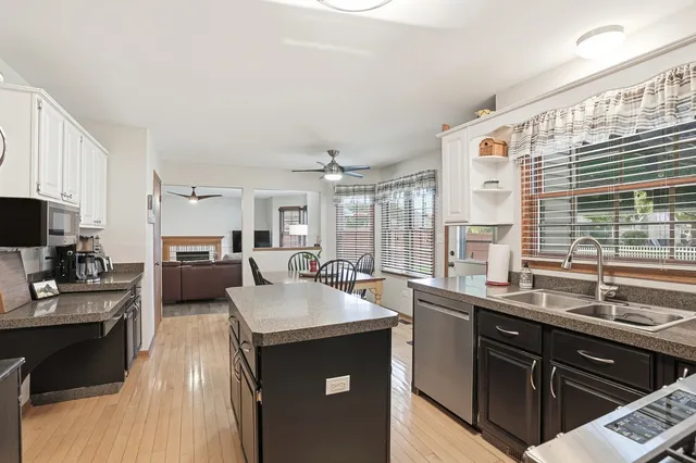 a kitchen with a sink stove and cabinets