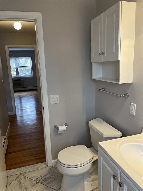 114 Colonial Circle, Unit C Chicopee, MA 01020 - Photo 11 of 16 a white toilet sitting next to a bathroom sink