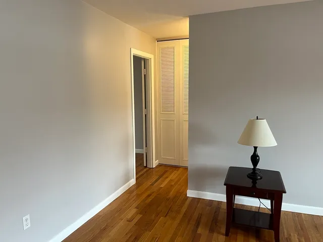 a view of a room with a table and a chair