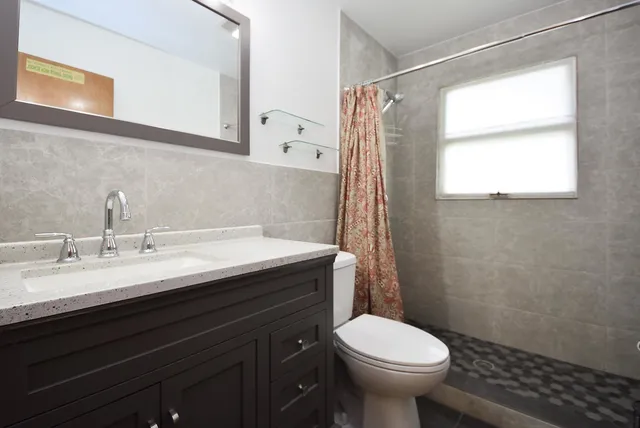 a bathroom with a toilet a sink and bathtub