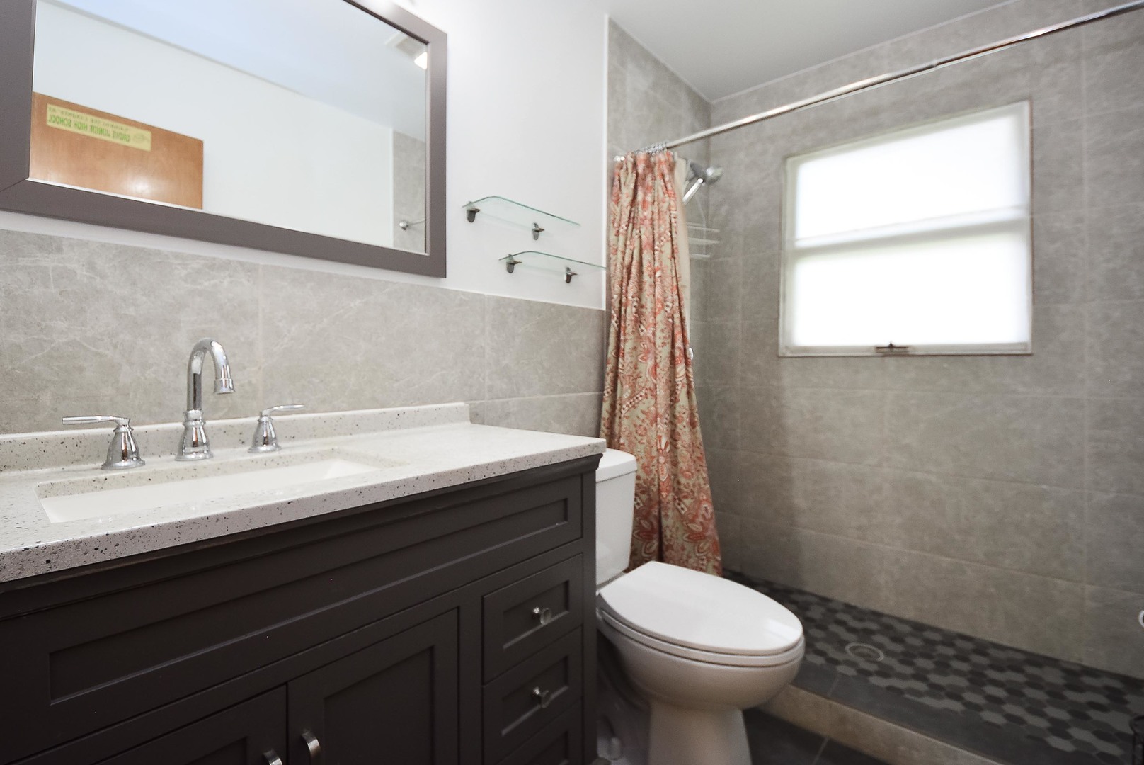 50 Ridgewood Road Elk Grove Village, IL 60007 - Photo 17 of 21 a bathroom with a sink a toilet and a mirror
