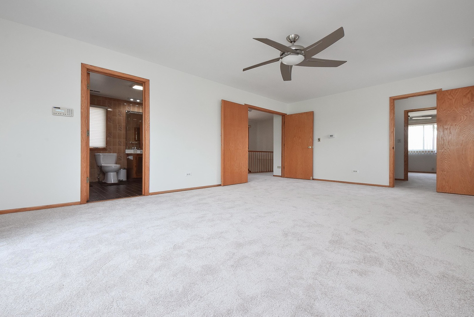 50 Ridgewood Road Elk Grove Village, IL 60007 - Photo 10 of 21 a view of an empty room with a ceiling fan