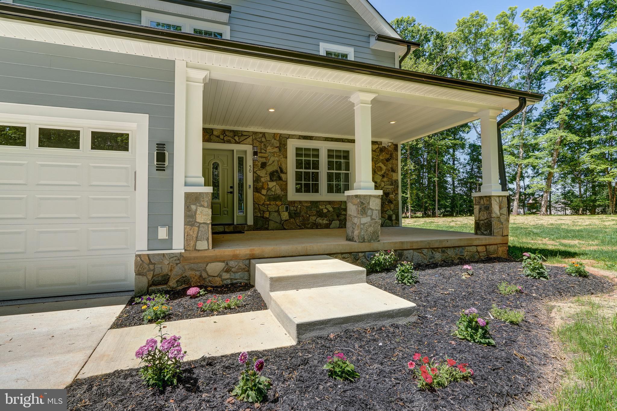 50 Retriever Court Bumpass, VA 23024 - Photo 12 of 77 a view of a house with backyard and garden