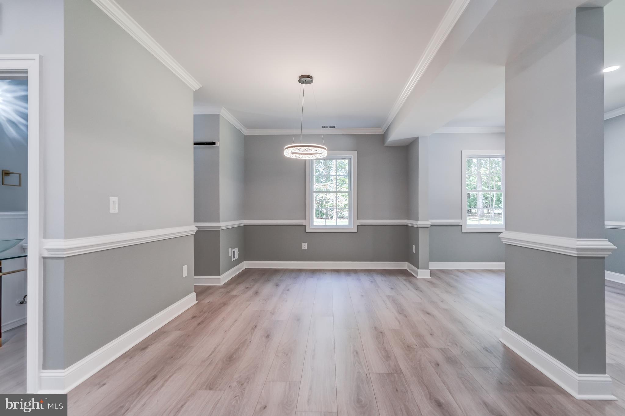 50 Retriever Court Bumpass, VA 23024 - Photo 21 of 77 wooden floor in an empty room with a window