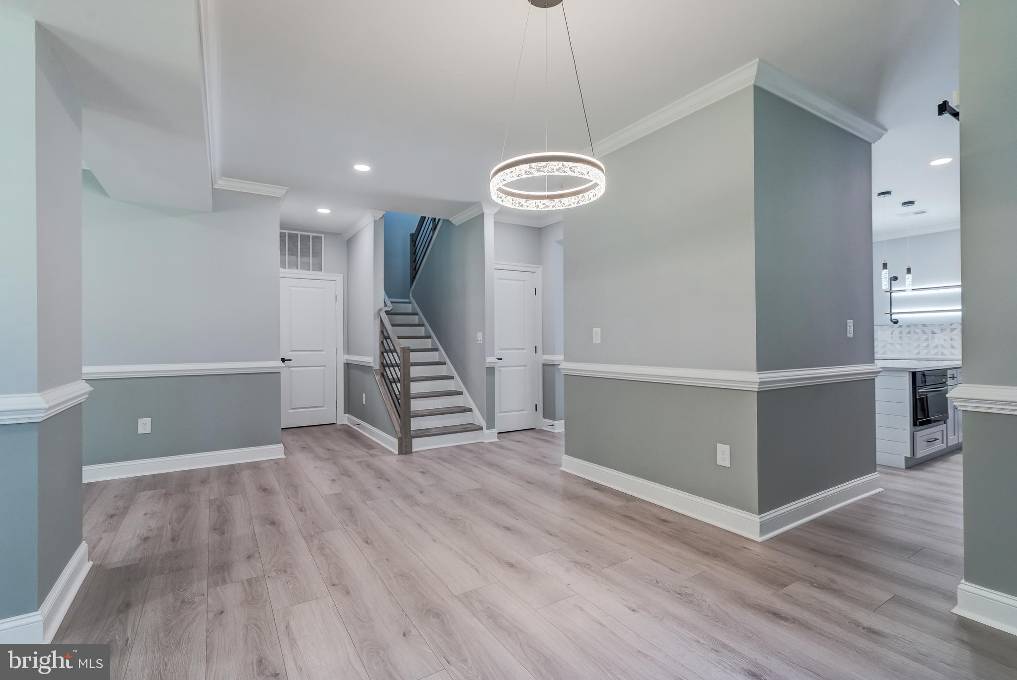 50 Retriever Court Bumpass, VA 23024 - Photo 23 of 77 a view of an empty room with wooden floor and a ceiling fan