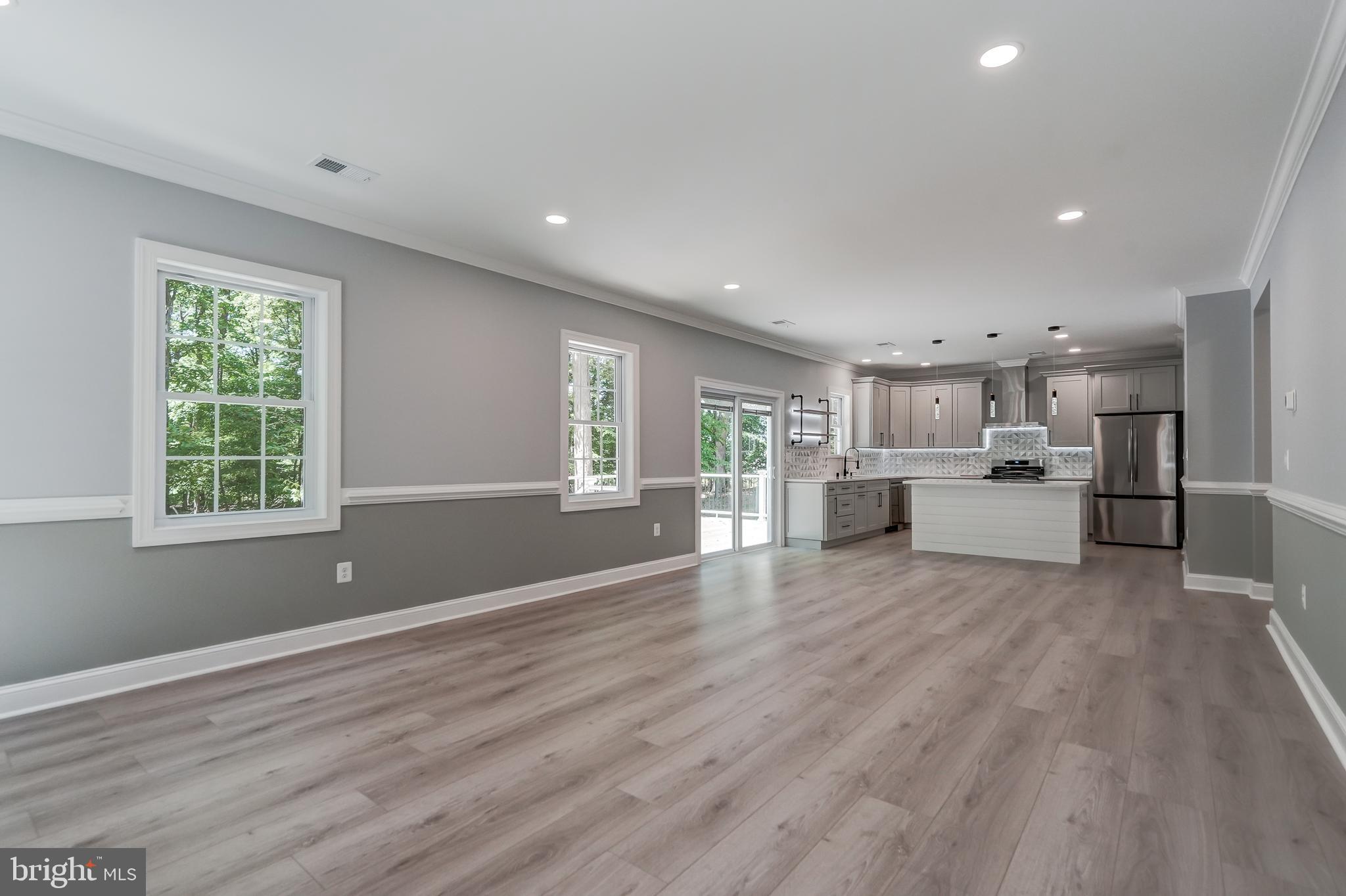 50 Retriever Court Bumpass, VA 23024 - Photo 26 of 77 a view of empty room with wooden floor and windows