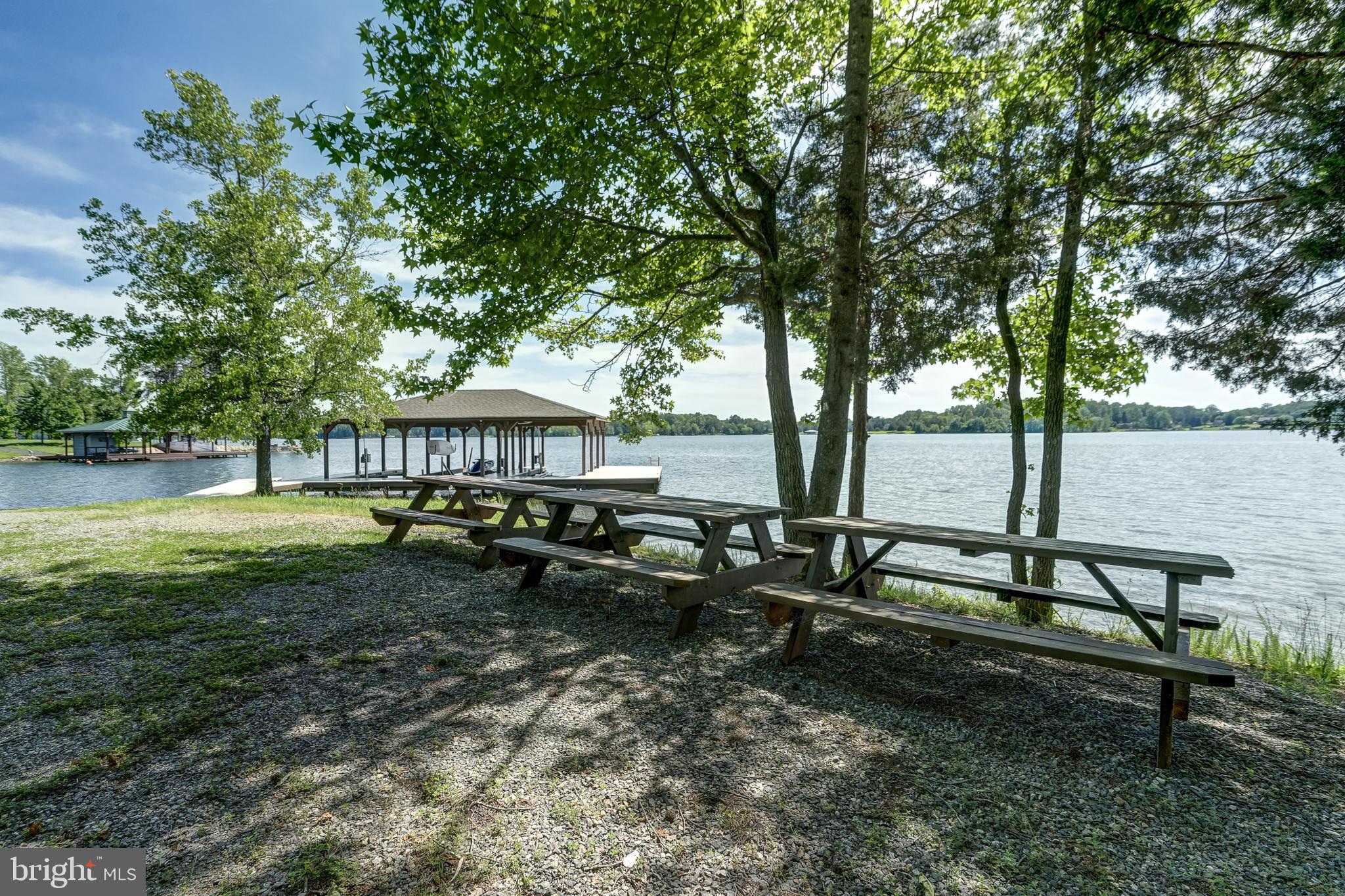 50 Retriever Court Bumpass, VA 23024 - Photo 3 of 77 a view of a bench sitting in the middle of a park