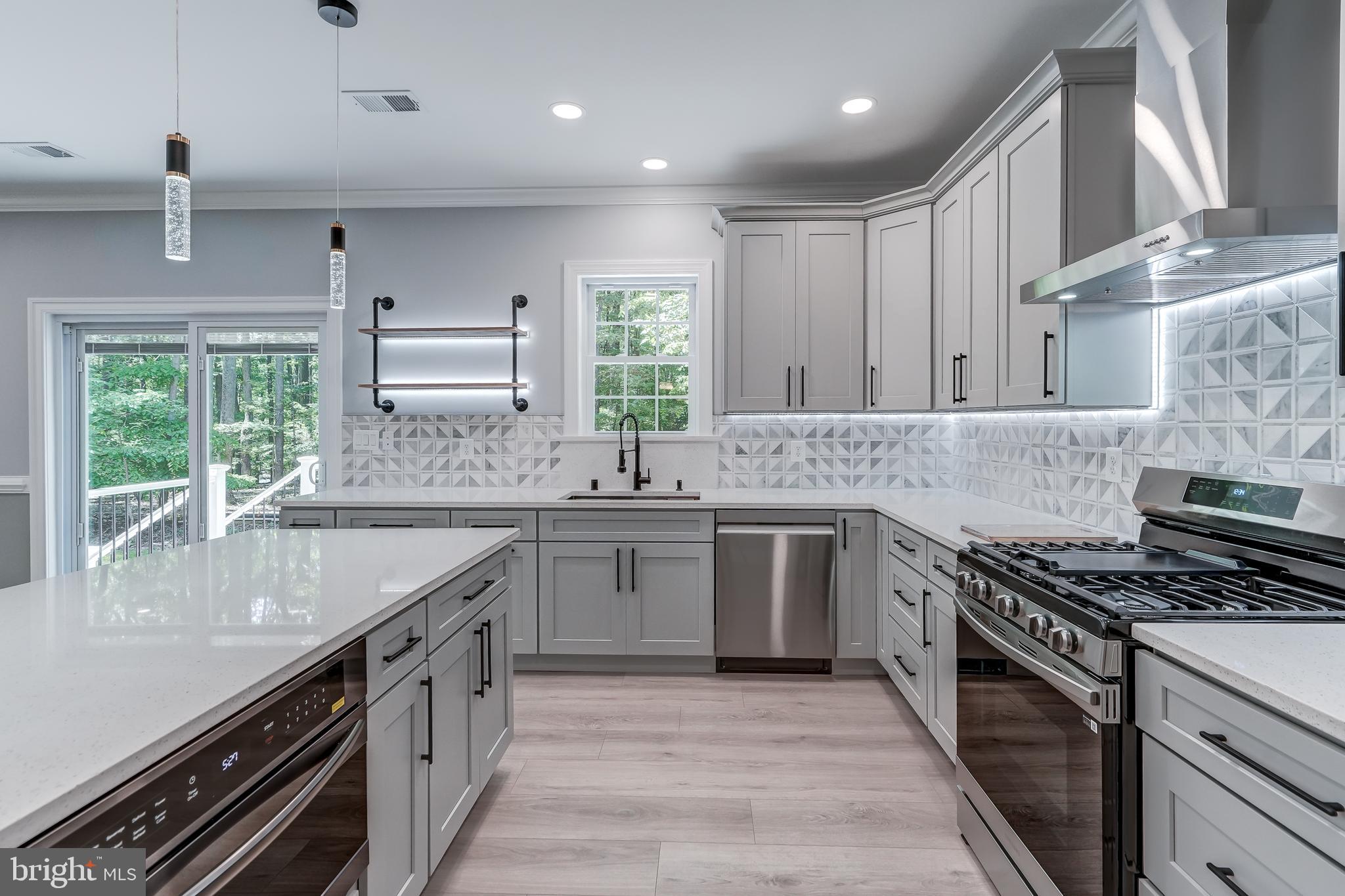 50 Retriever Court Bumpass, VA 23024 - Photo 31 of 77 a kitchen with stainless steel appliances granite countertop a sink stove and cabinets