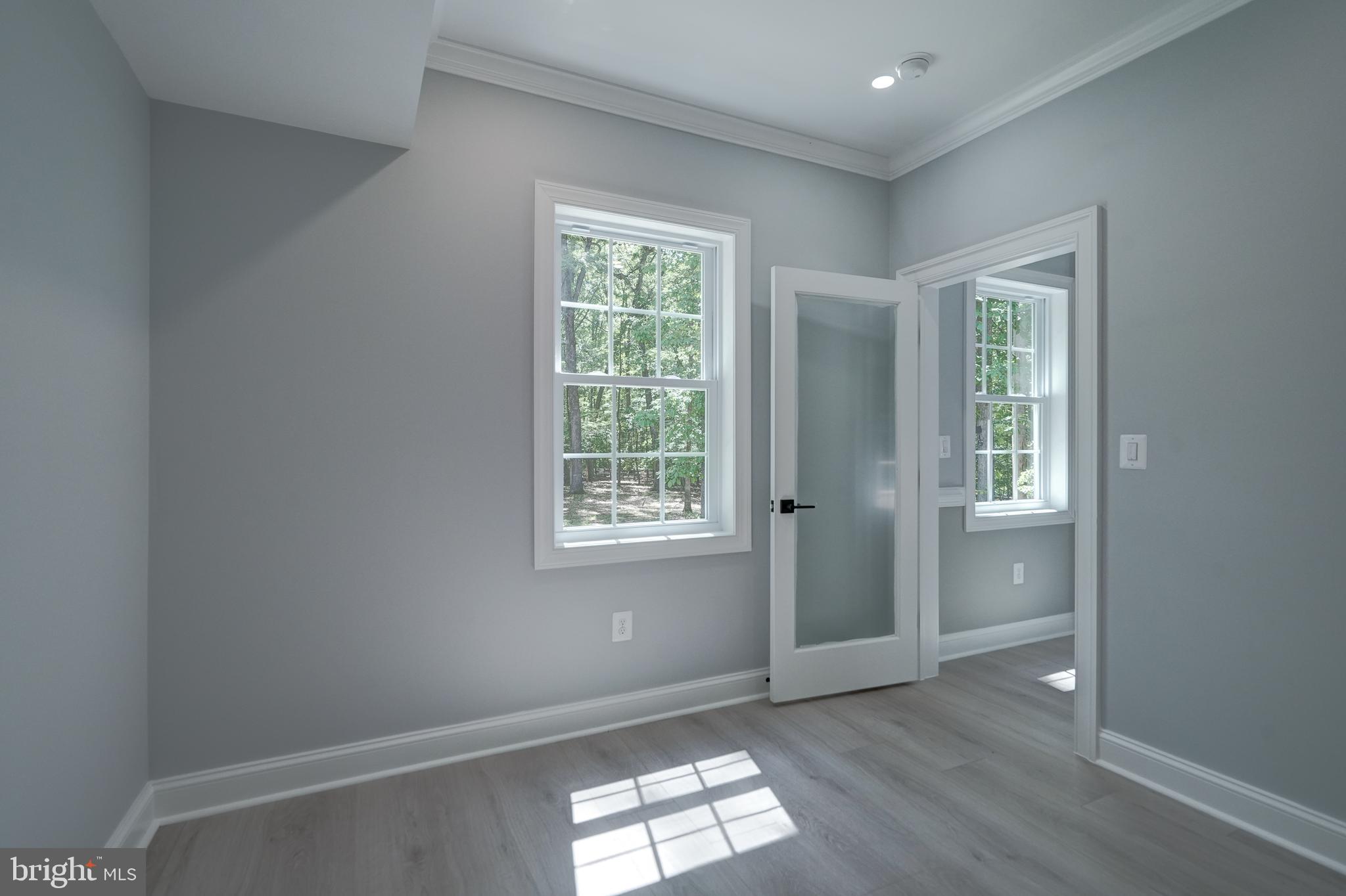 50 Retriever Court Bumpass, VA 23024 - Photo 42 of 77 a view of empty room with wooden floor and fan