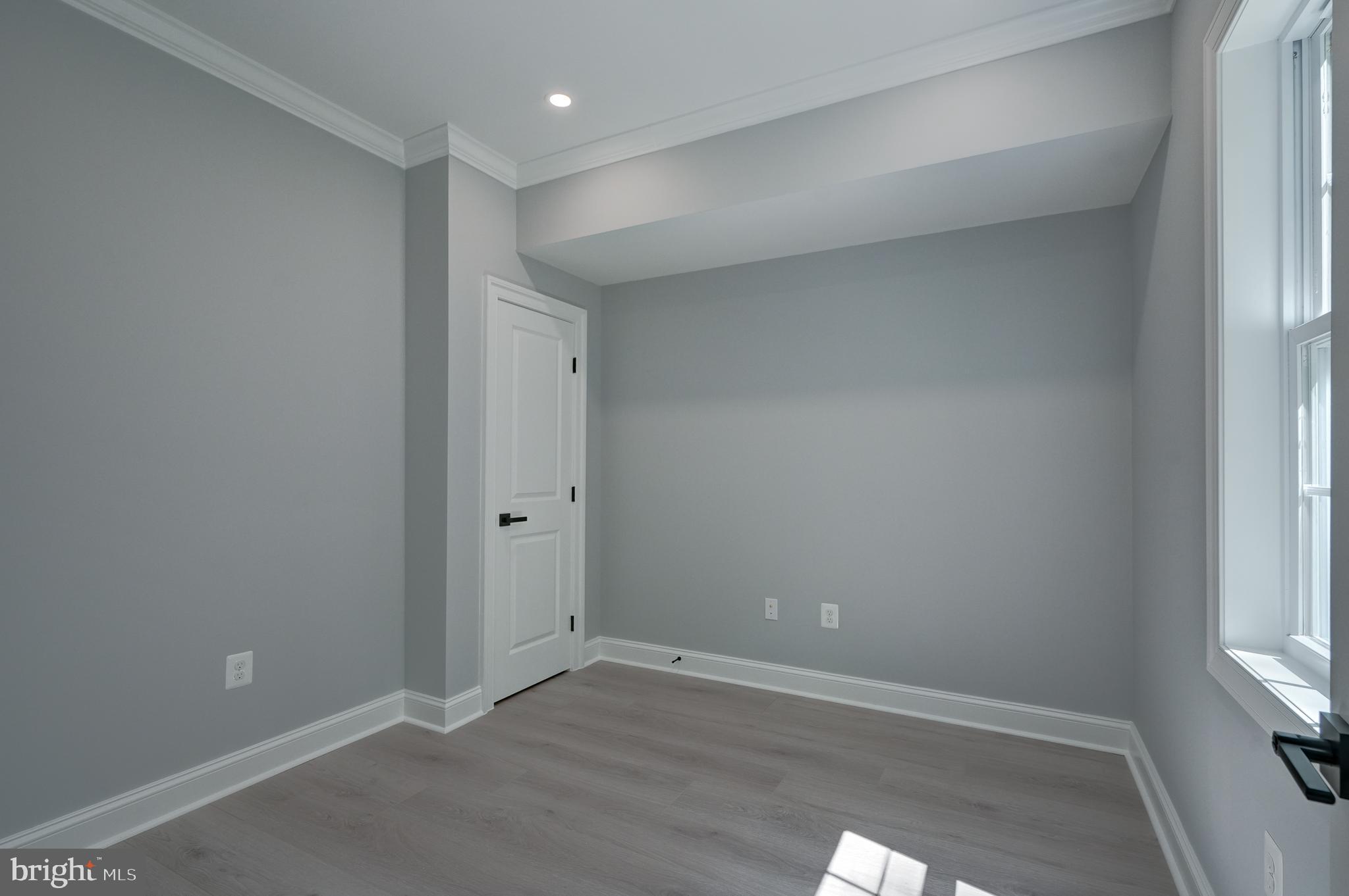 50 Retriever Court Bumpass, VA 23024 - Photo 43 of 77 a view of an empty room with wooden floor and a window