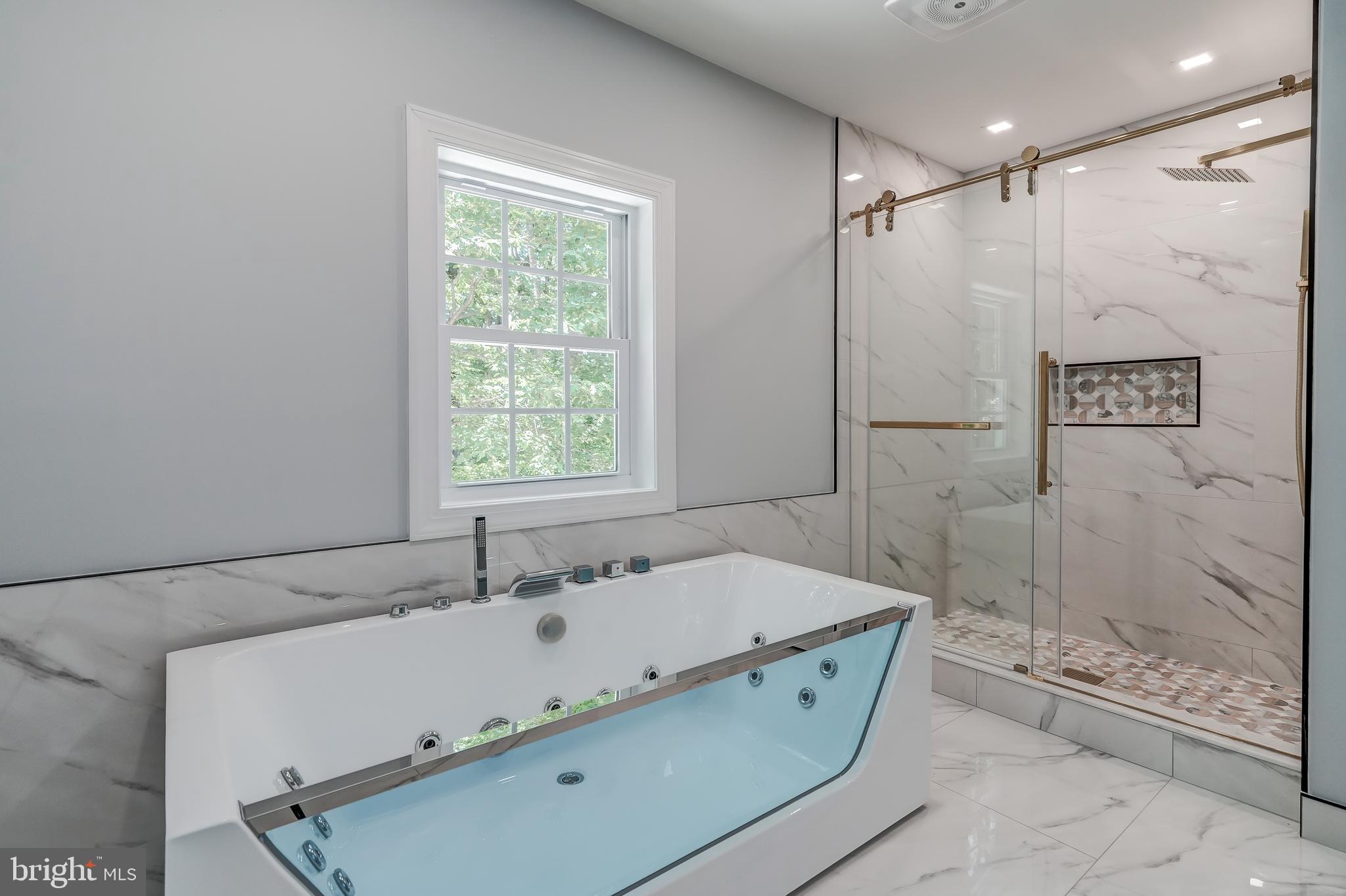 50 Retriever Court Bumpass, VA 23024 - Photo 50 of 77 a bathroom with a tub a sink and shower