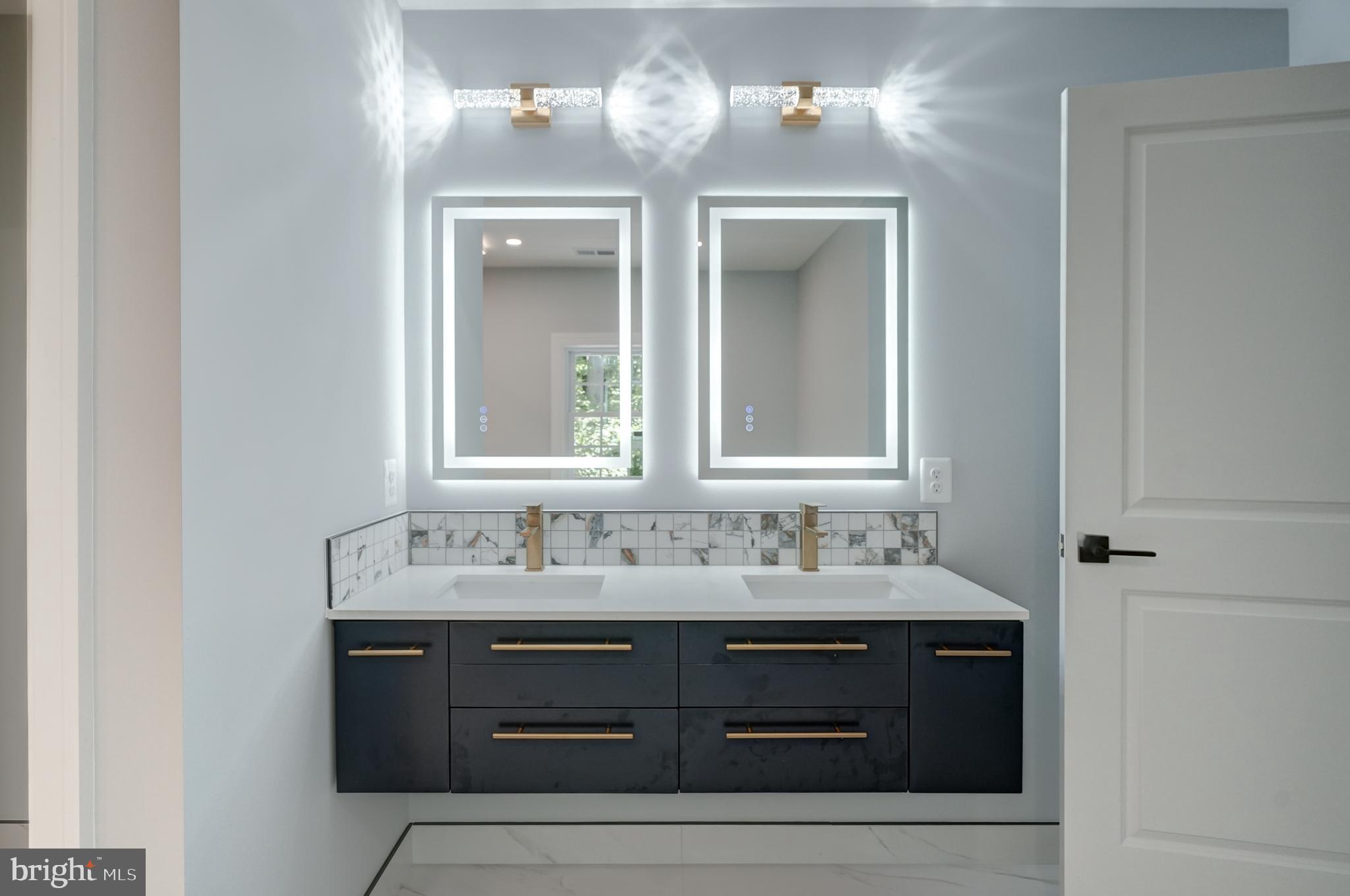 50 Retriever Court Bumpass, VA 23024 - Photo 51 of 77 a bathroom with a sink vanity and a mirror