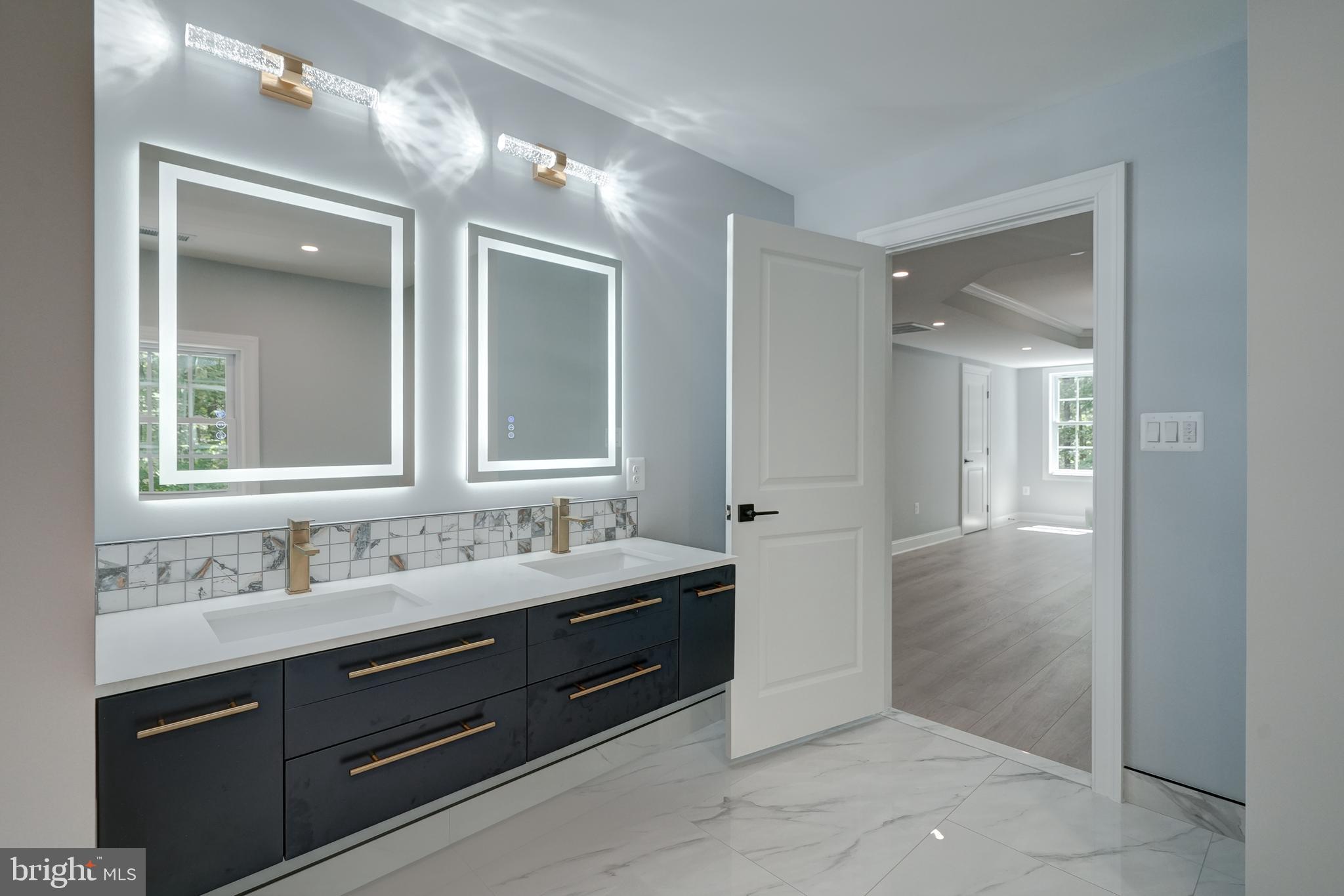 50 Retriever Court Bumpass, VA 23024 - Photo 52 of 77 a spacious bathroom with a double vanity sink and a mirror