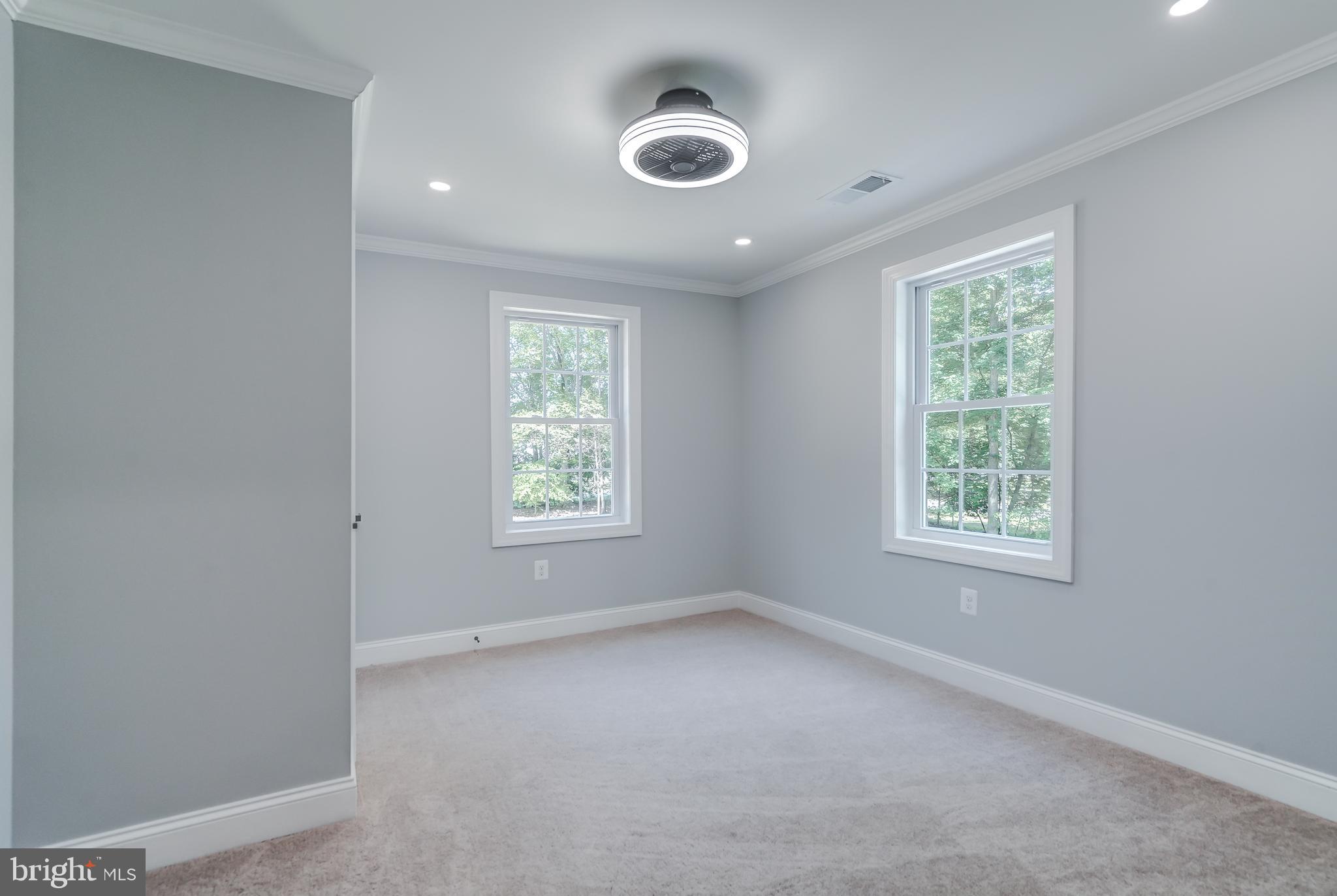 50 Retriever Court Bumpass, VA 23024 - Photo 56 of 77 an empty room with a window and a fan