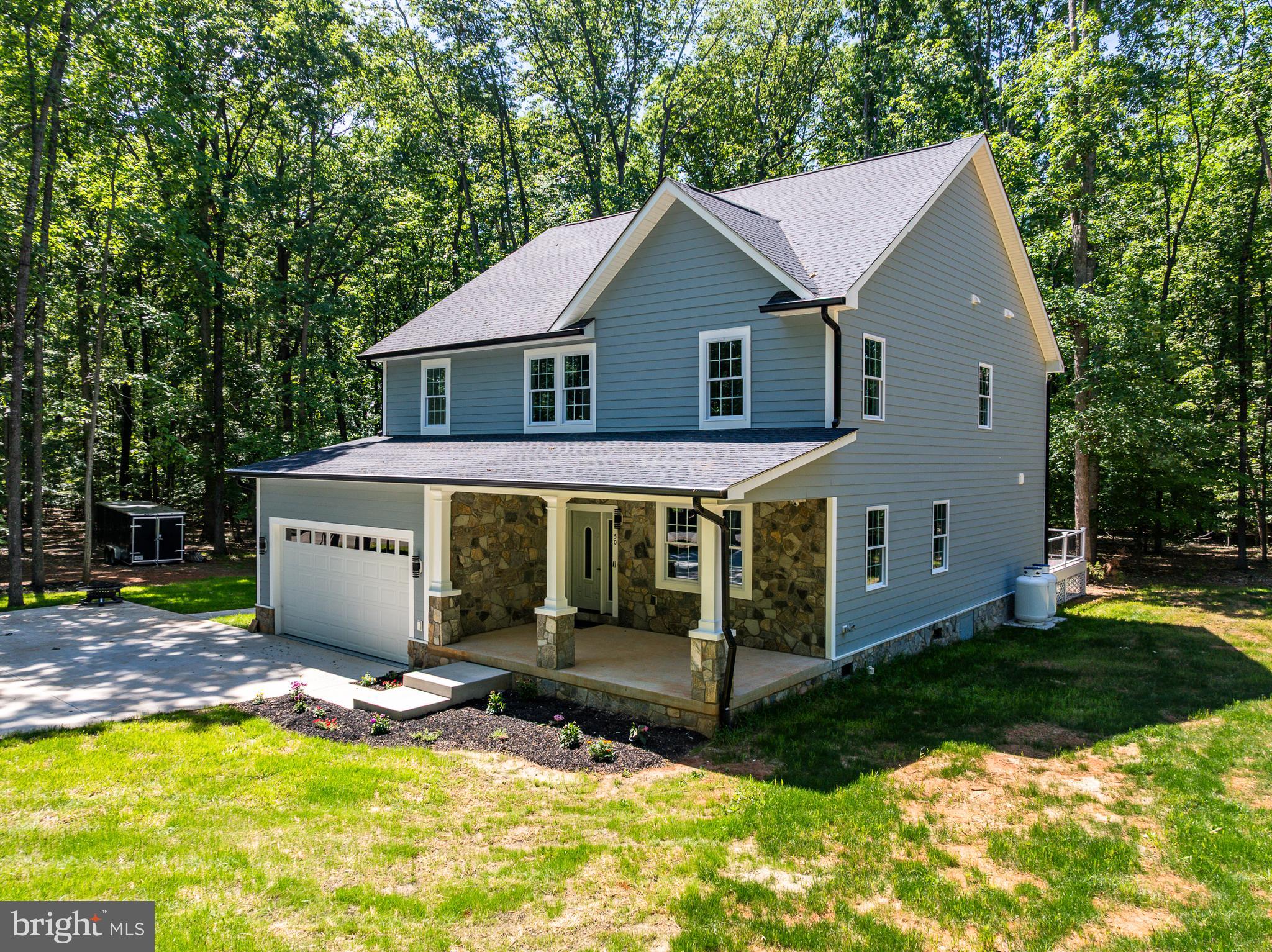 50 Retriever Court Bumpass, VA 23024 - Photo 75 of 77 a front view of a house with a yard