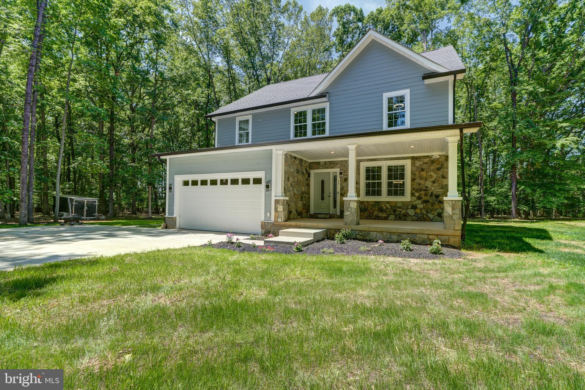 50 Retriever Court Bumpass, VA 23024 - Photo 76 of 77 a view of a house with backyard and garden