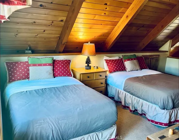 a bedroom with bed and a night stand