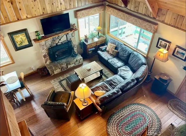 a living room with furniture fireplace and a flat screen tv