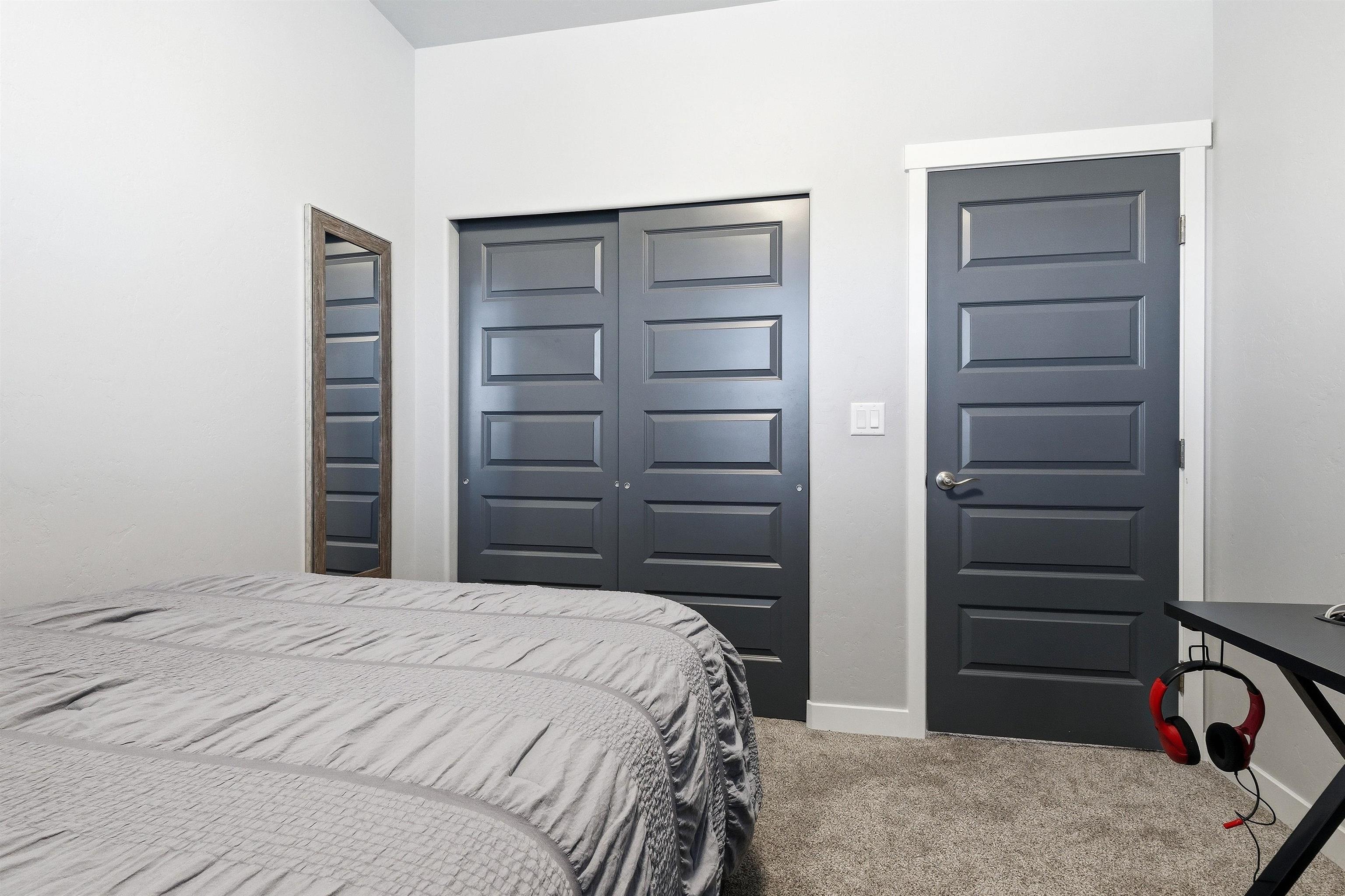 2459 Hamilton Road, Unit A Grand Junction, CO 81505 - Photo 18 of 27 a bedroom with a bed and a dresser