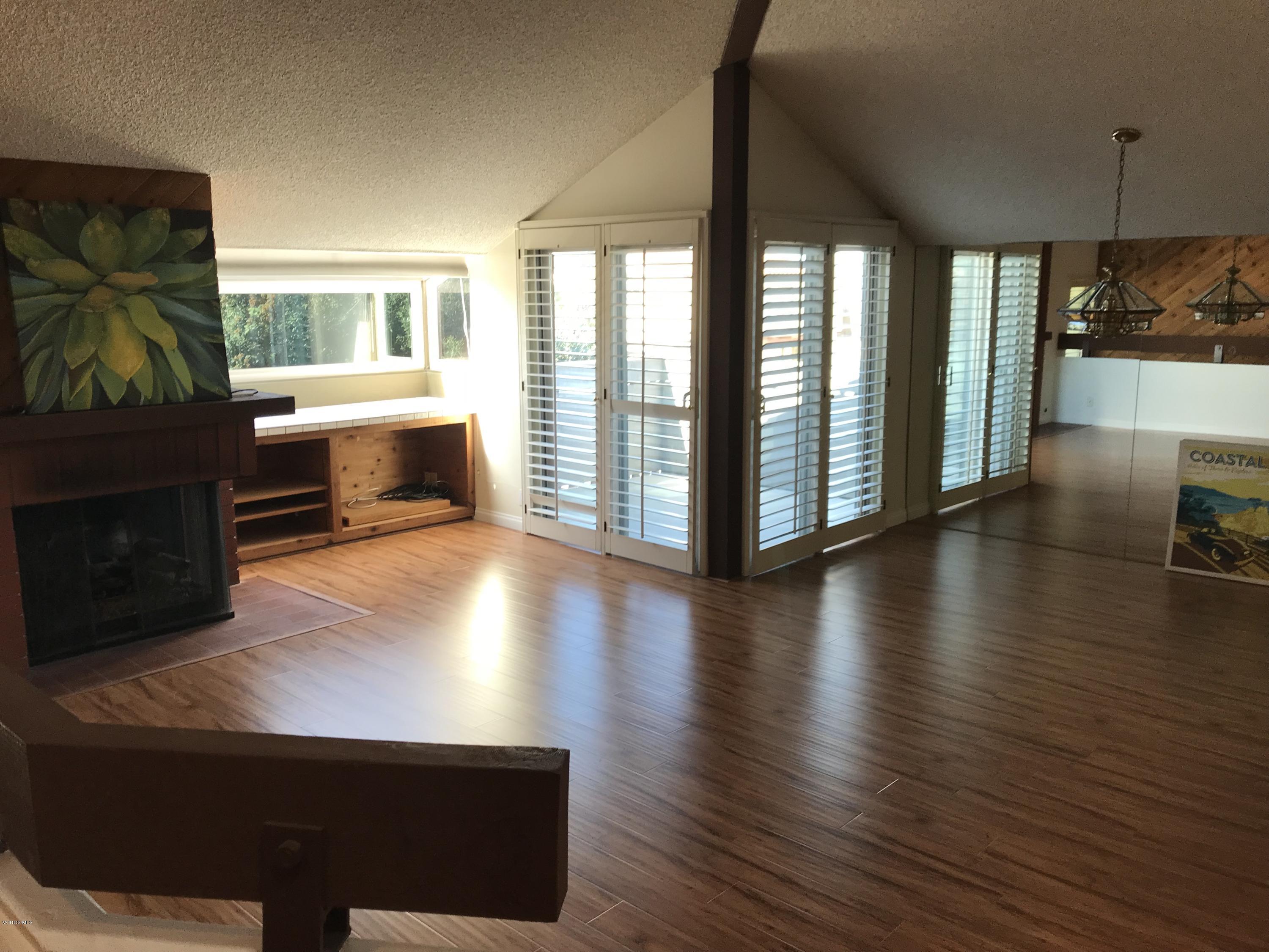 3484 Sunset Lane Oxnard, CA 93035 - Photo 2 of 9 a view of a living room a dining room with furniture and wooden floor