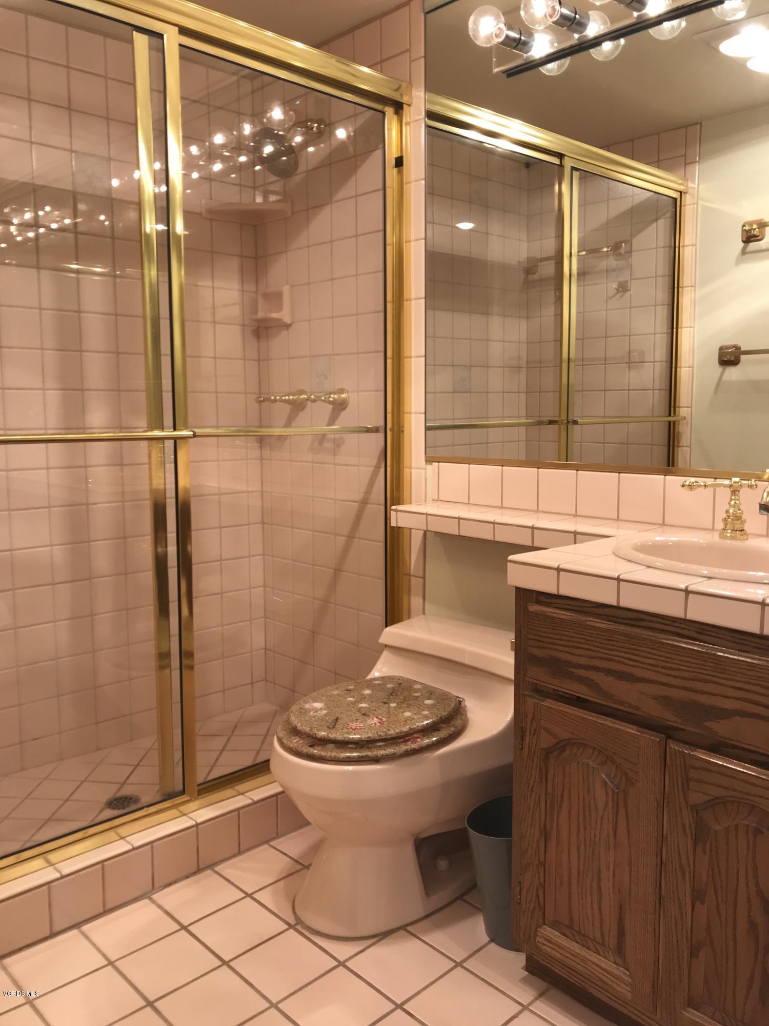 3484 Sunset Lane Oxnard, CA 93035 - Photo 7 of 9 a bathroom with a sink toilet and shower