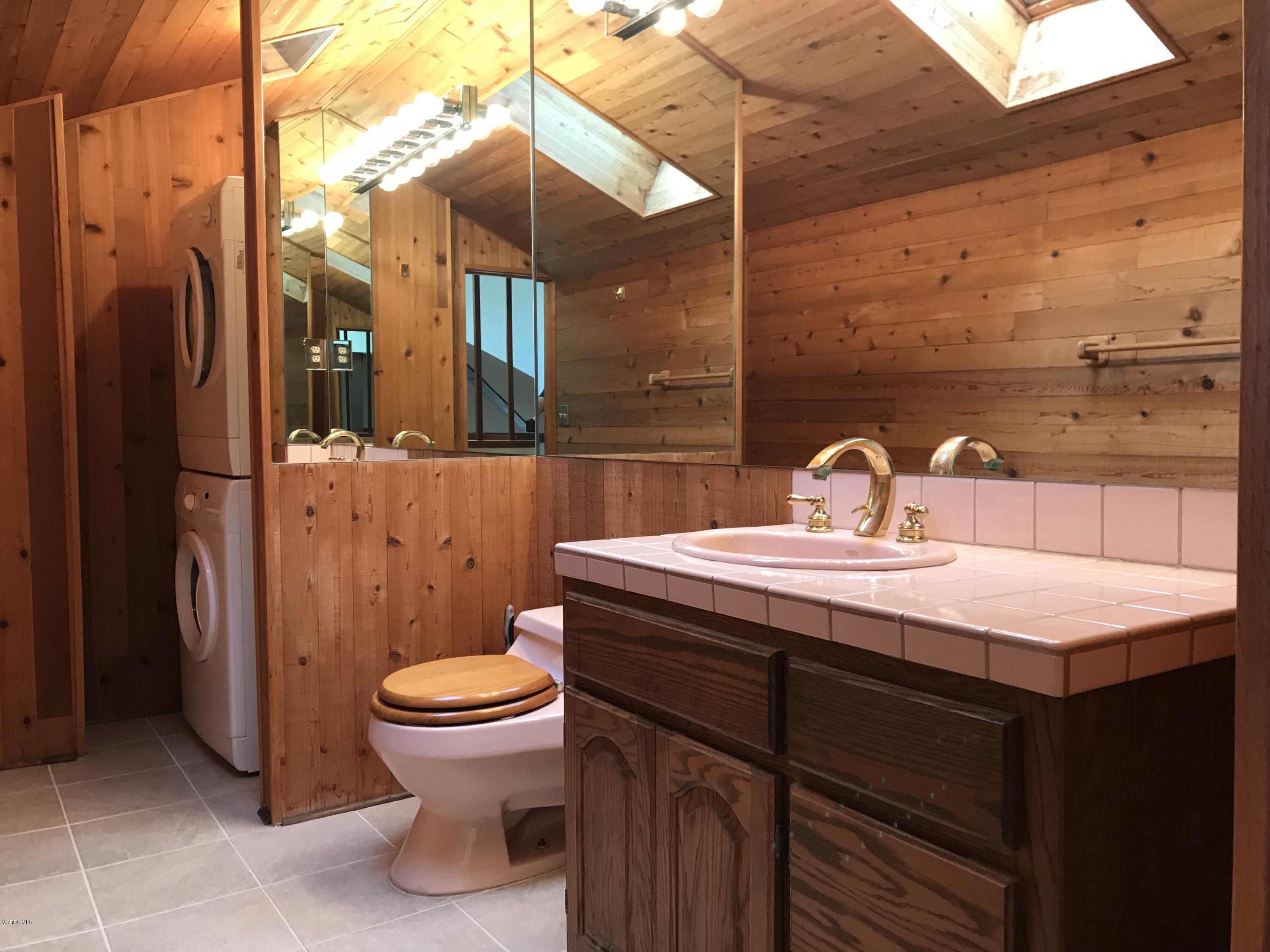 3484 Sunset Lane Oxnard, CA 93035 - Photo 8 of 9 a bathroom with a sink a toilet and shower