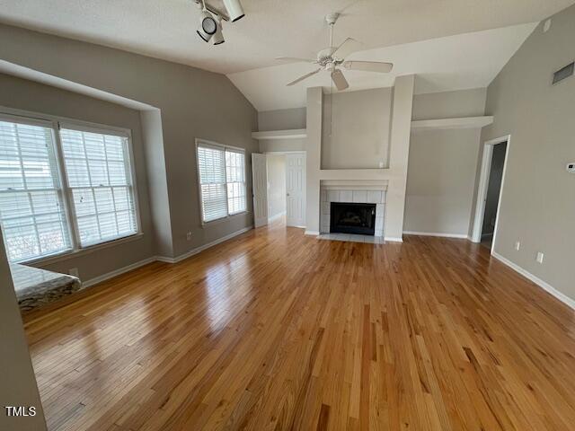 109 Tabula Place Cary, NC 27513 - Photo 2 of 26 wooden floor fireplace and windows in an empty room