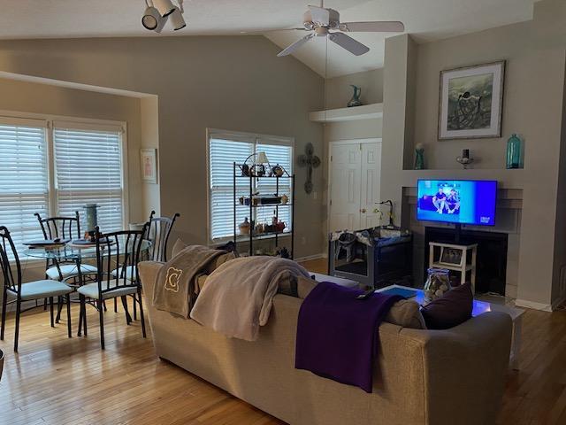 109 Tabula Place Cary, NC 27513 - Photo 3 of 26 a living room with furniture a dining table and a flat screen tv