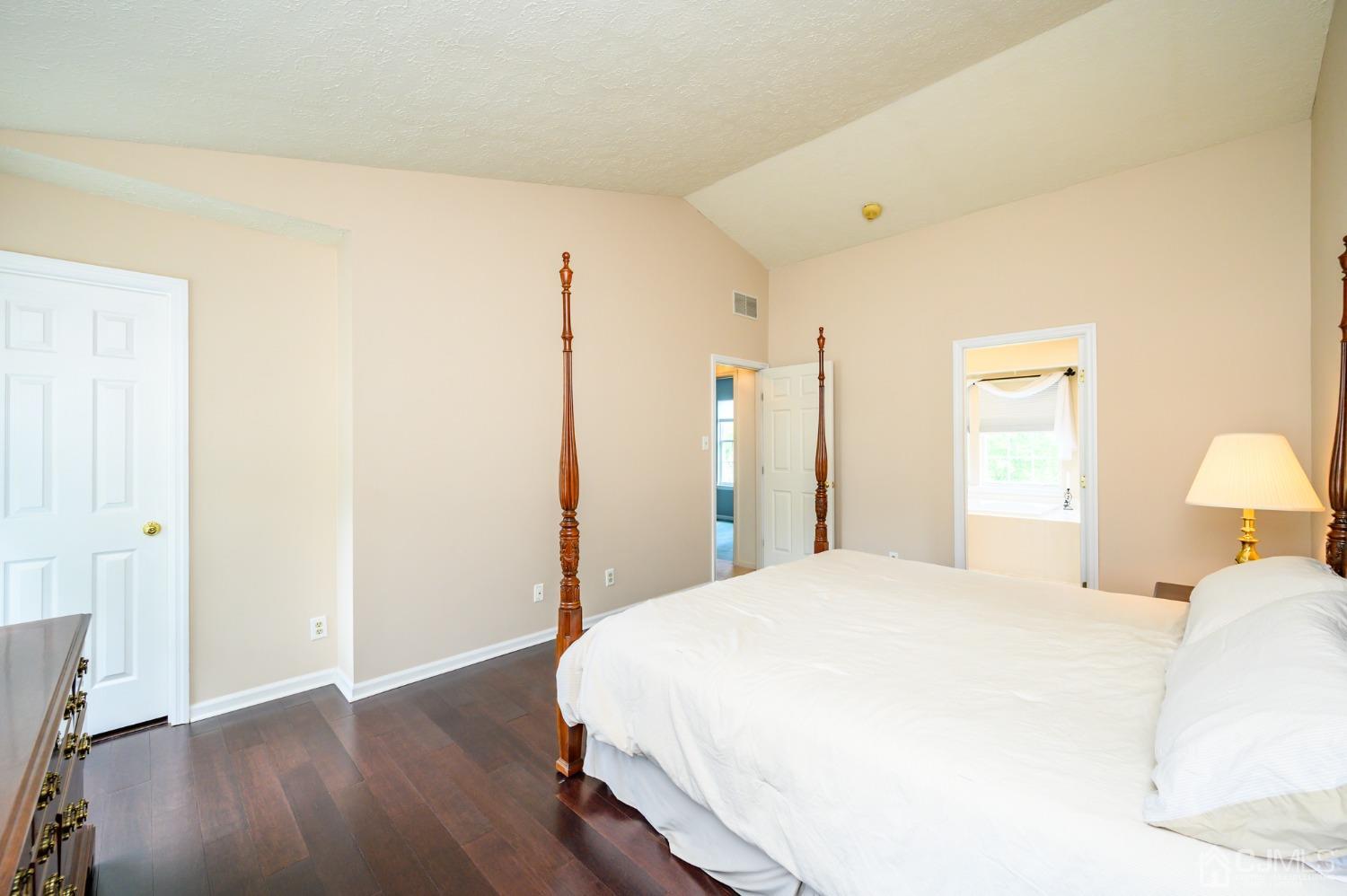 709 Henderson Road Lumberton, NJ 08048 - Photo 30 of 46 a bedroom with a bed and wooden floor