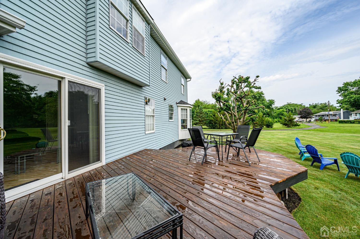 709 Henderson Road Lumberton, NJ 08048 - Photo 39 of 46 a view of a patio with table and chairs with wooden floor and fence