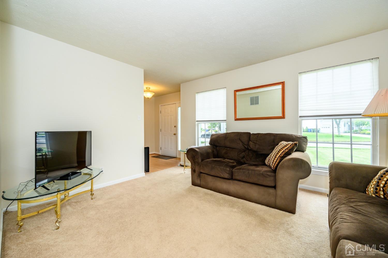 709 Henderson Road Lumberton, NJ 08048 - Photo 5 of 46 a living room with furniture and a flat screen tv