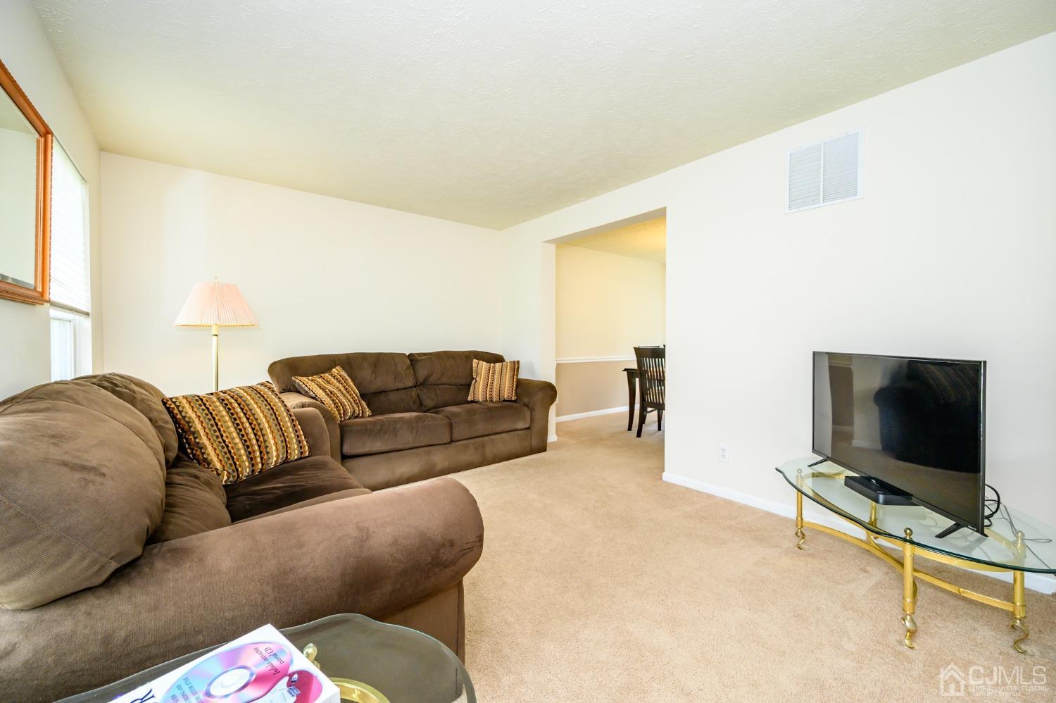 709 Henderson Road Lumberton, NJ 08048 - Photo 6 of 46 a living room with furniture and a flat screen tv