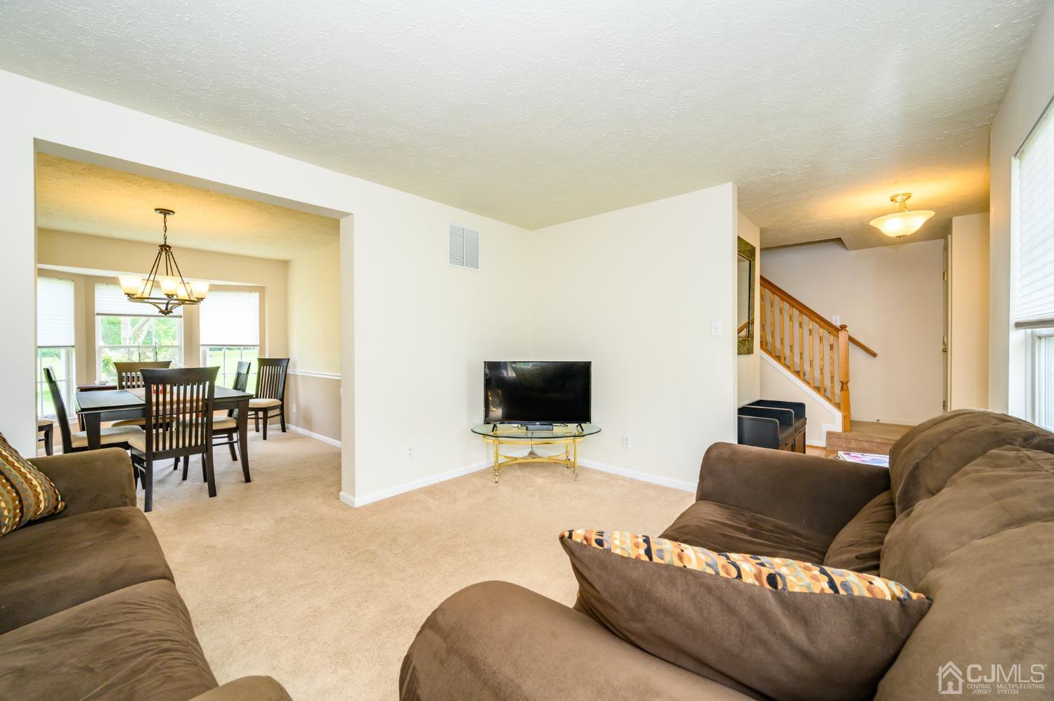 709 Henderson Road Lumberton, NJ 08048 - Photo 7 of 46 a living room with furniture and a flat screen tv
