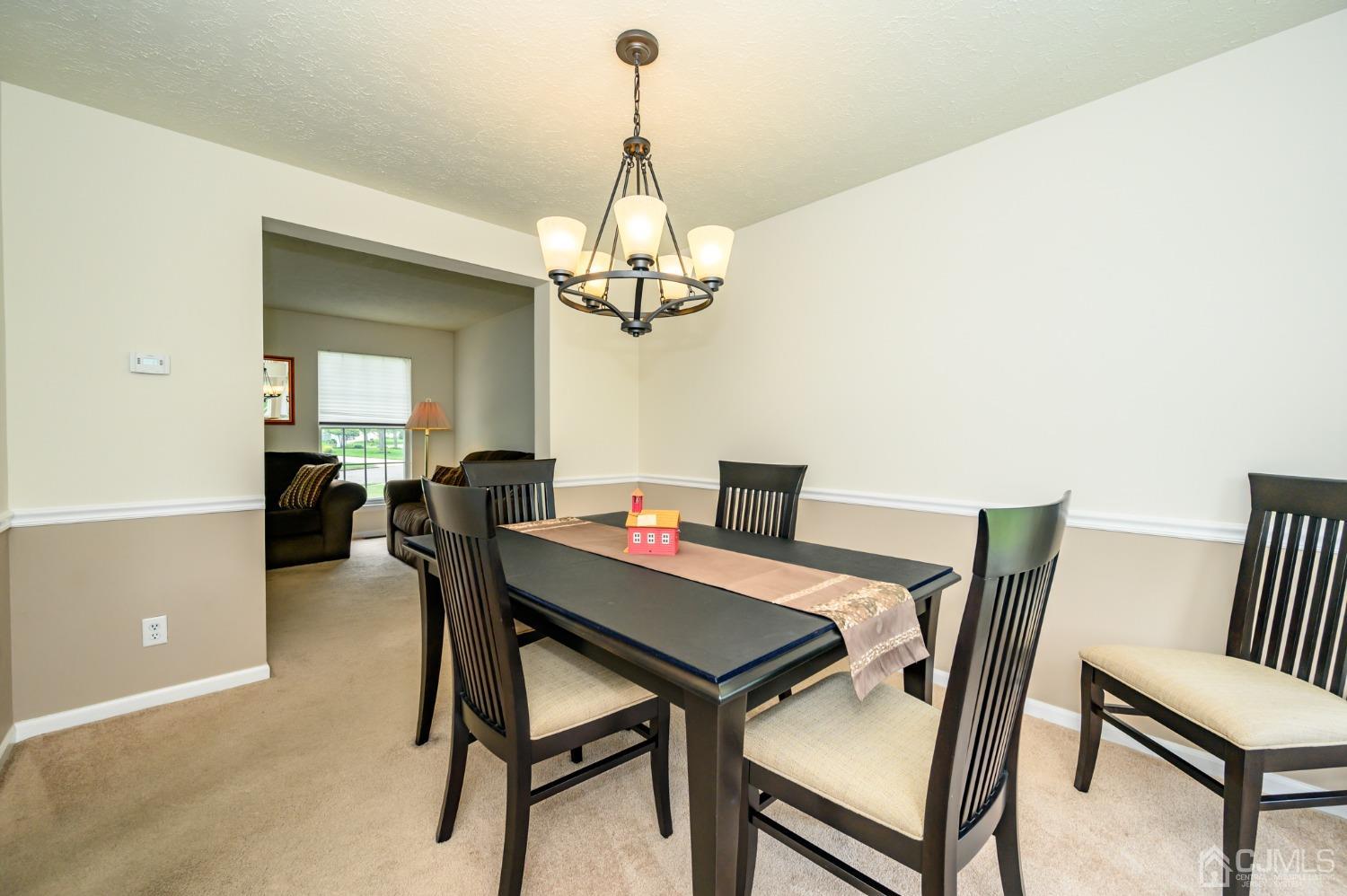 709 Henderson Road Lumberton, NJ 08048 - Photo 8 of 46 a view of a dining room with furniture and a chandelier