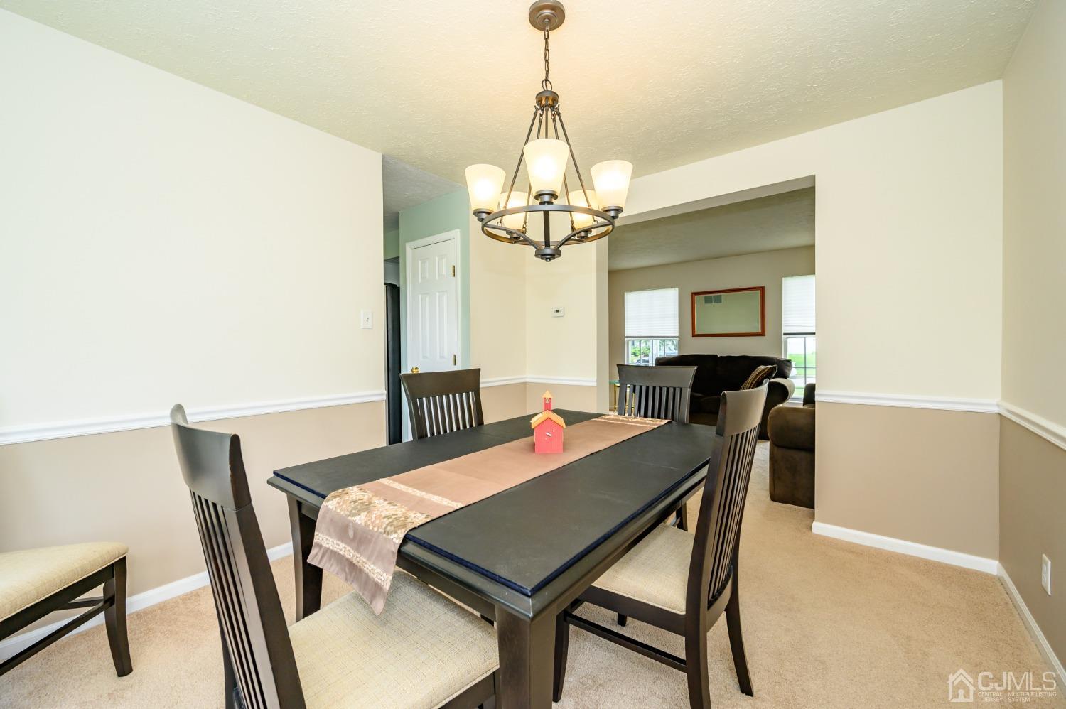 709 Henderson Road Lumberton, NJ 08048 - Photo 9 of 46 a view of a dining room with furniture and a chandelier