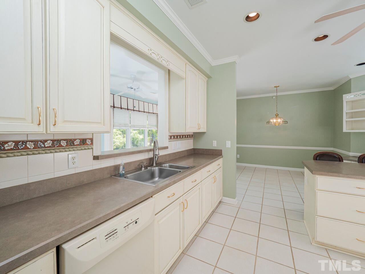 3701 Holly Lane, Unit 302 Raleigh, NC 27612 - Photo 11 of 30 Looking toward breakfast room and sunroom from wet bar.
