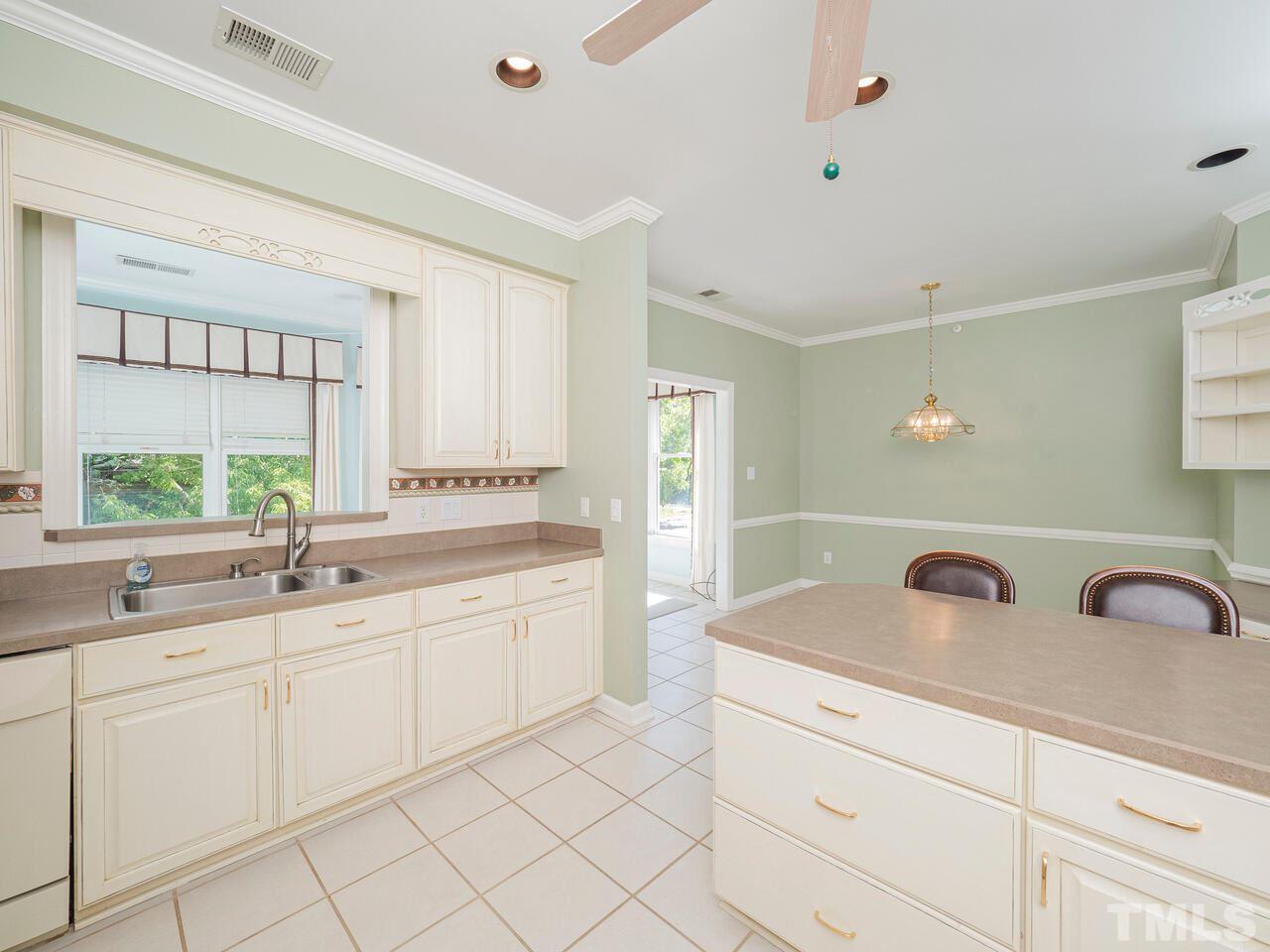 3701 Holly Lane, Unit 302 Raleigh, NC 27612 - Photo 12 of 30 Looking across breakfast bar toward breakfast room.