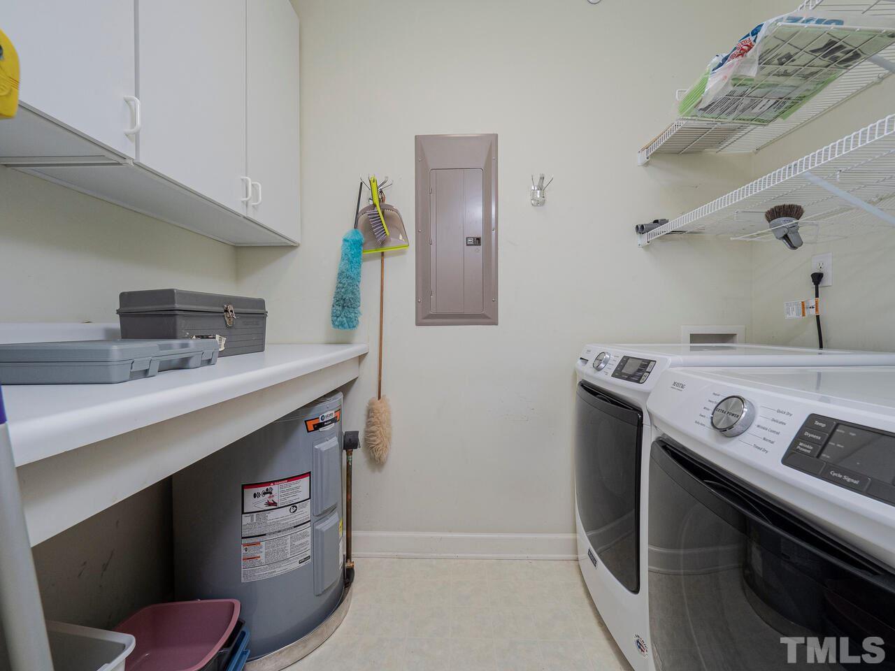 3701 Holly Lane, Unit 302 Raleigh, NC 27612 - Photo 26 of 30 Full laundry room with additional hot water heater.