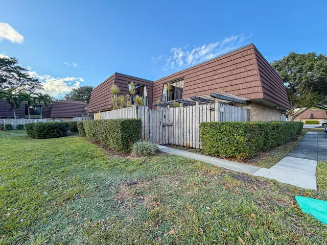 a house view with a backyard space