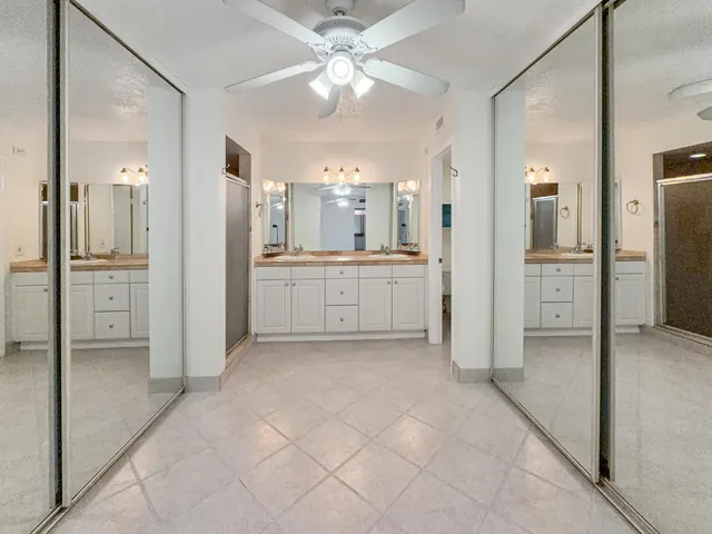 a view of a bathroom with a shower and a sink
