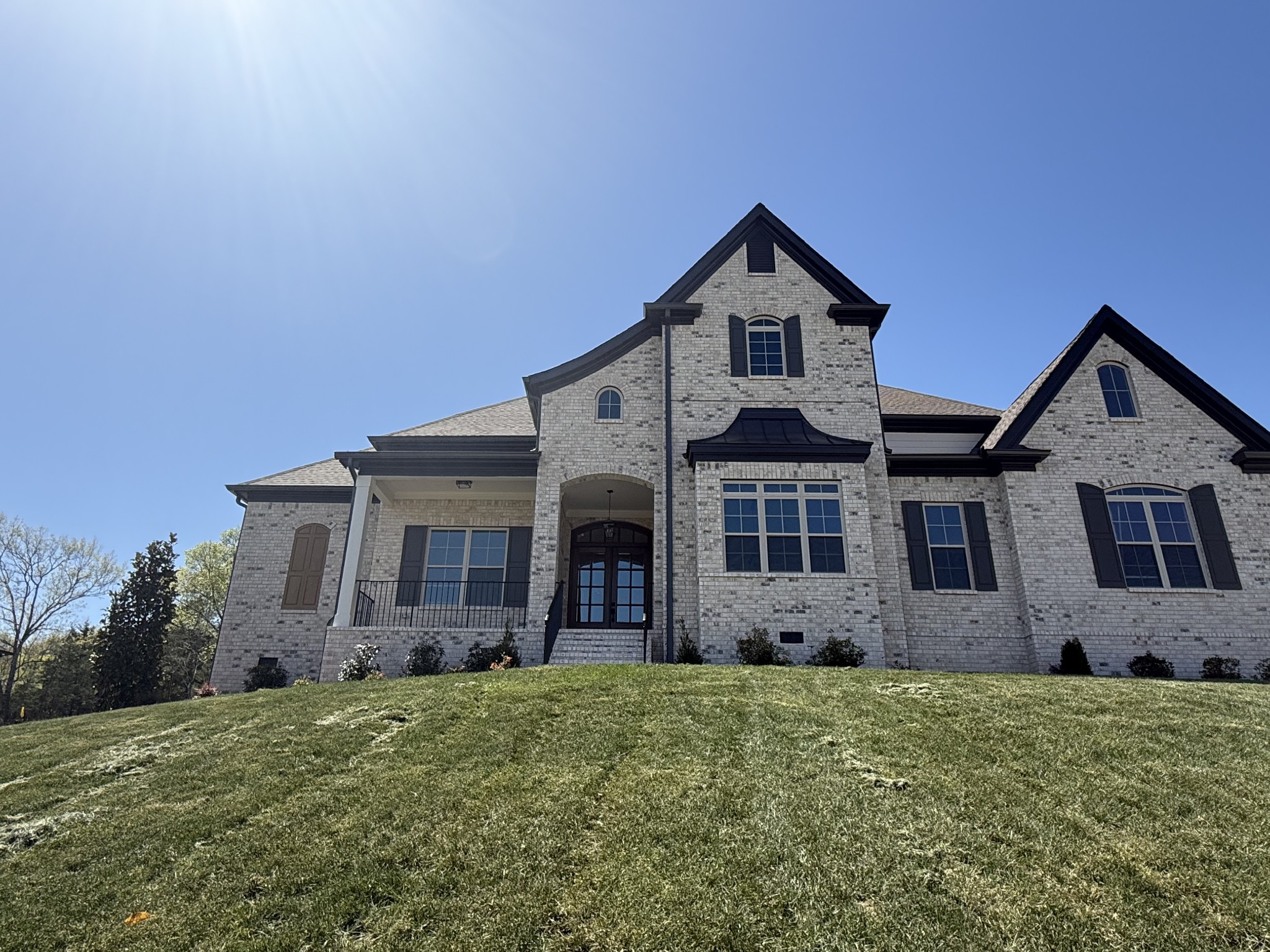 a front view of a house with garden