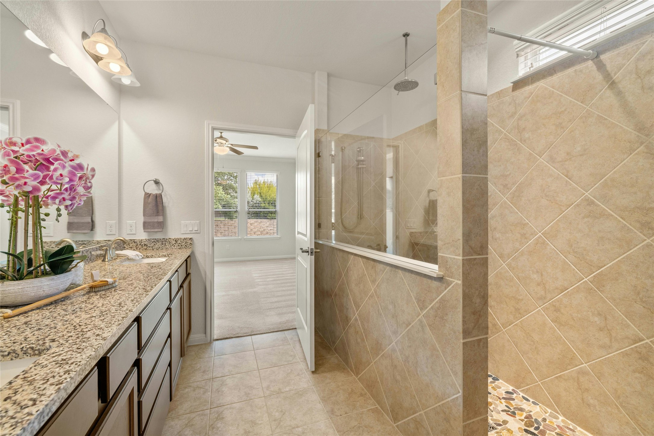 203 Longview Lane Georgetown, TX 78633 - Photo 25 of 37 a bathroom with a granite countertop shower a sink and a mirror
