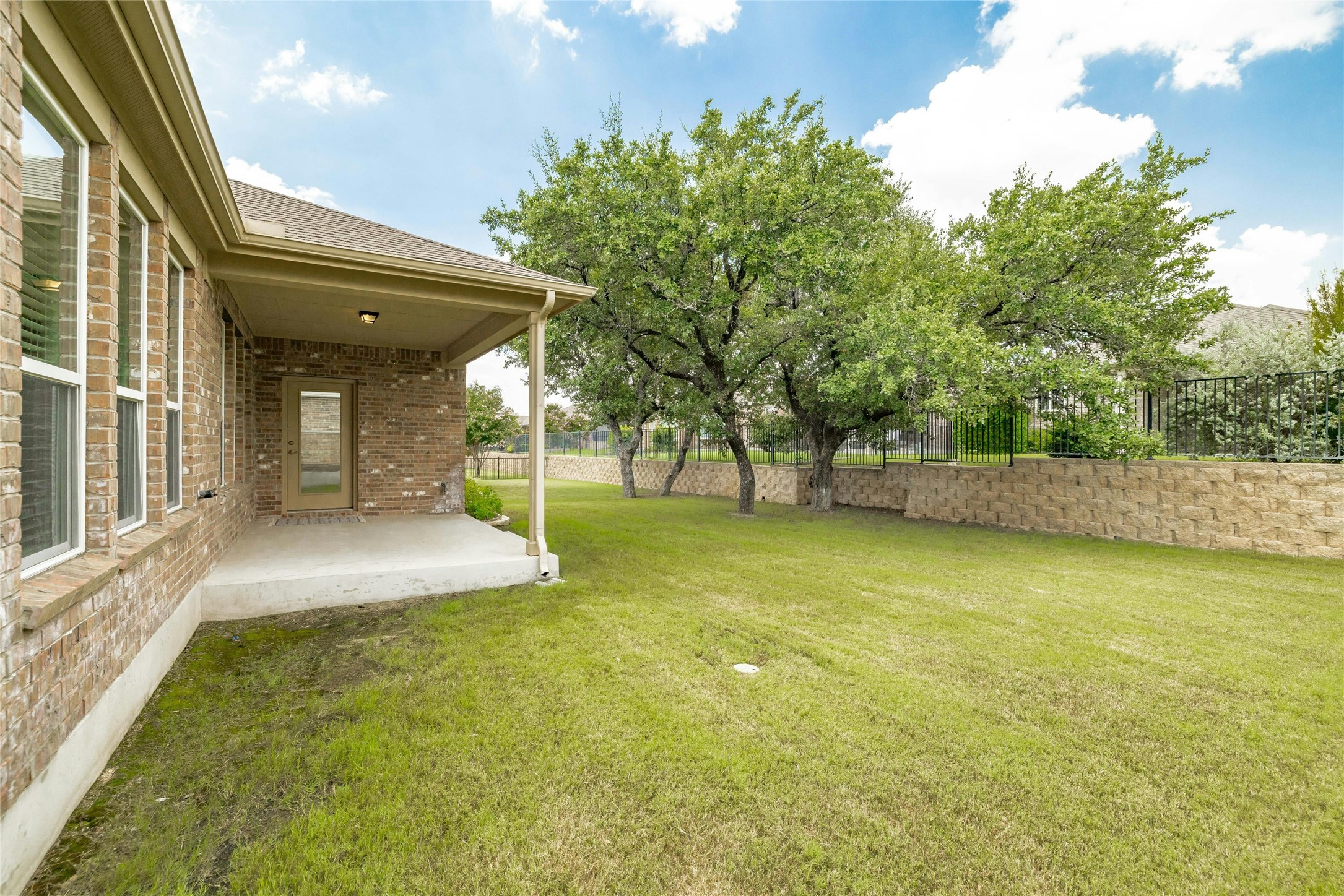 203 Longview Lane Georgetown, TX 78633 - Photo 35 of 37 a view of a patio with table and chairs and potted plants