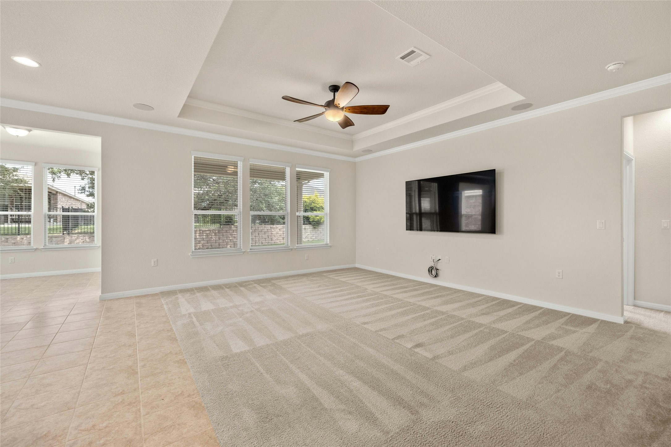 203 Longview Lane Georgetown, TX 78633 - Photo 4 of 37 an empty room with windows and ceiling fan