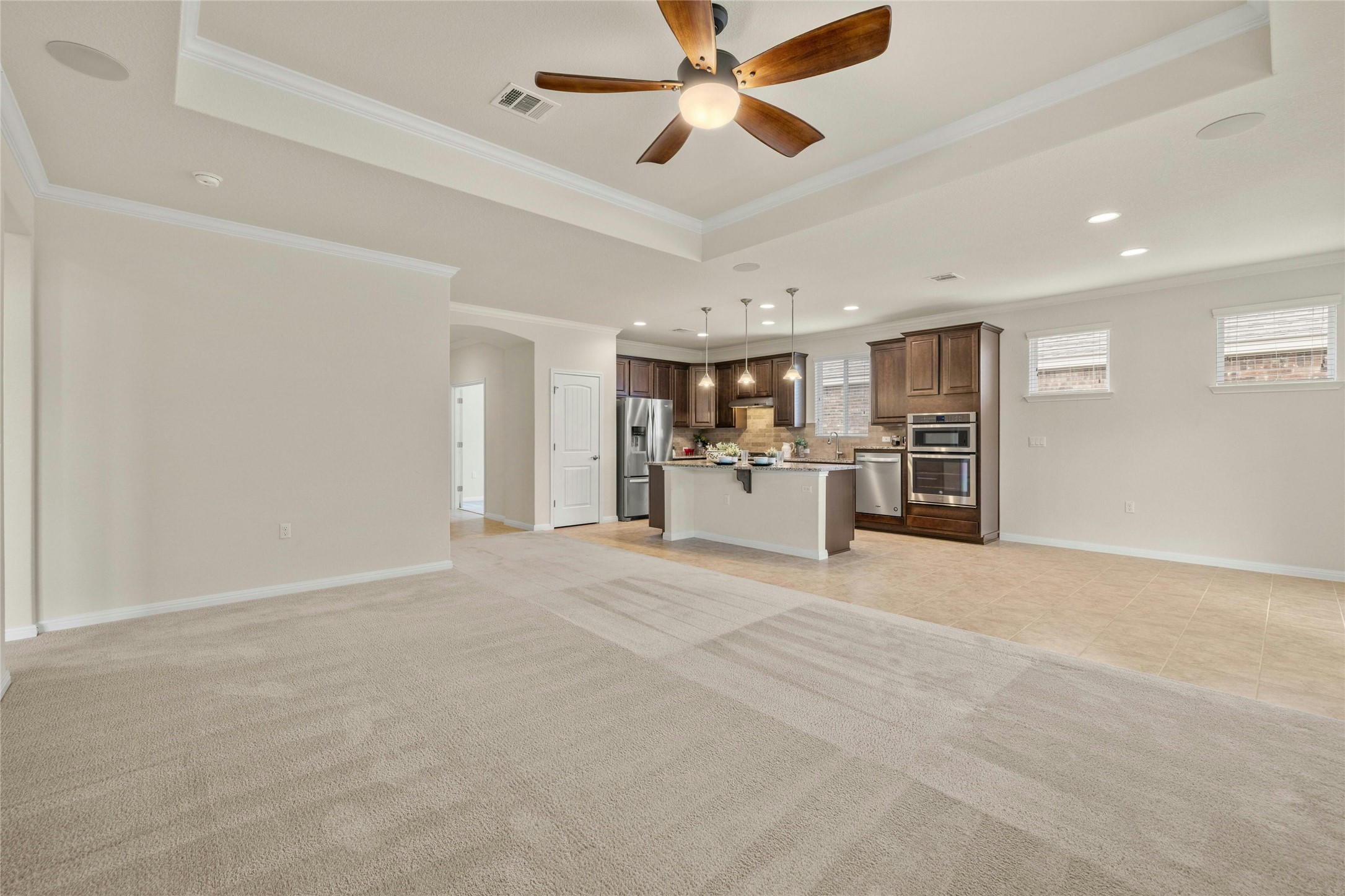 203 Longview Lane Georgetown, TX 78633 - Photo 7 of 37 a view of a kitchen with a sink and a refrigerator