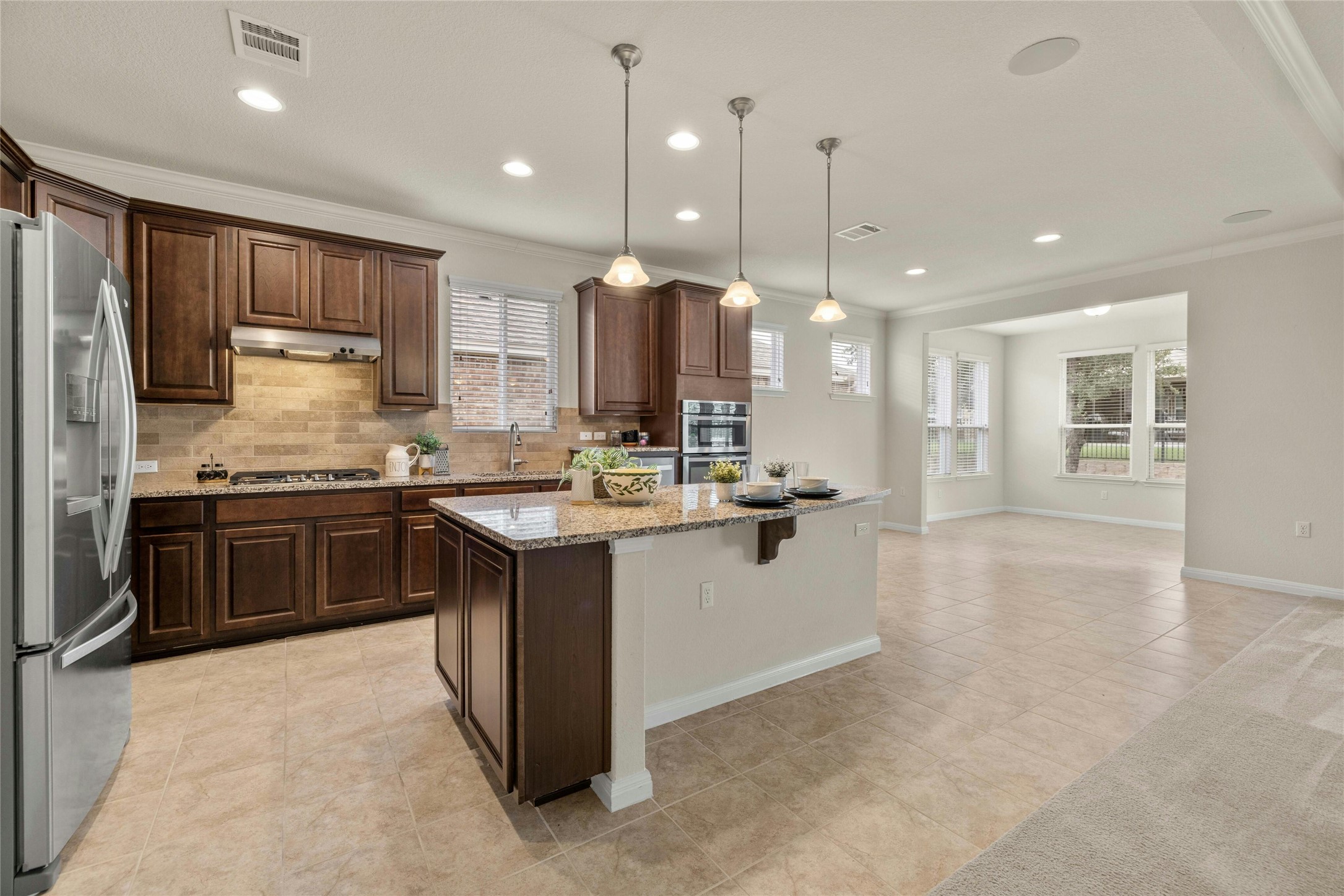 203 Longview Lane Georgetown, TX 78633 - Photo 9 of 37 a kitchen with a sink stove and refrigerator