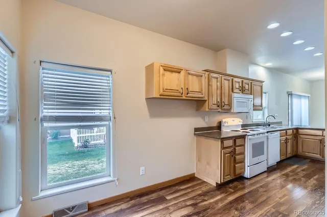 a kitchen with stainless steel appliances granite countertop a stove and a sink
