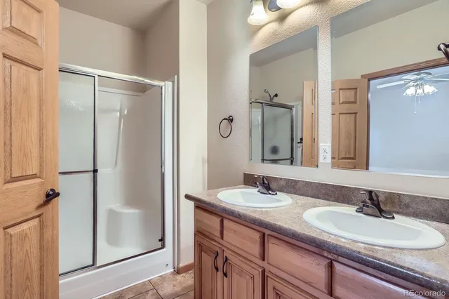 a bathroom with a double vanity sink mirror and double